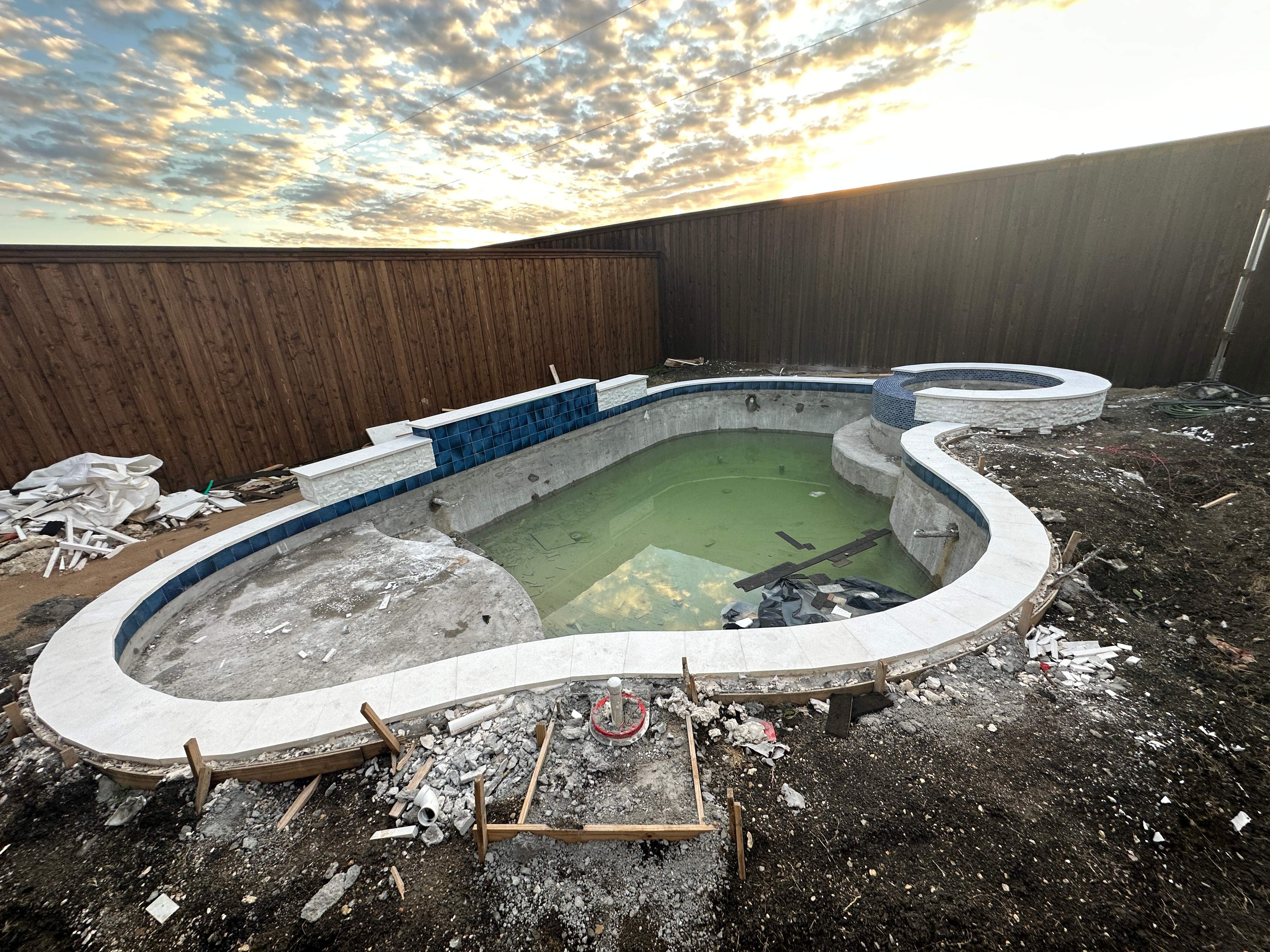 Freeform Pool with Rock Waterfall and Raised Spa by Pinnacle Pools and Spas - DFW