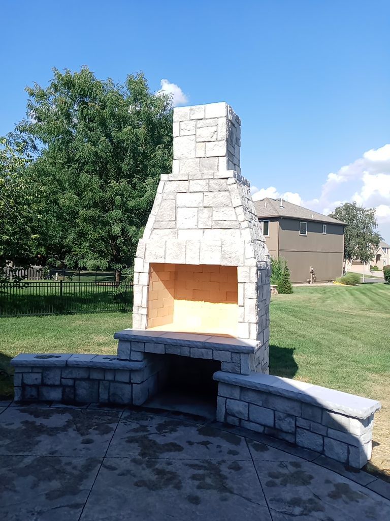 Back Yard Fireplace and Landscape by LAND ESCAPES LLC