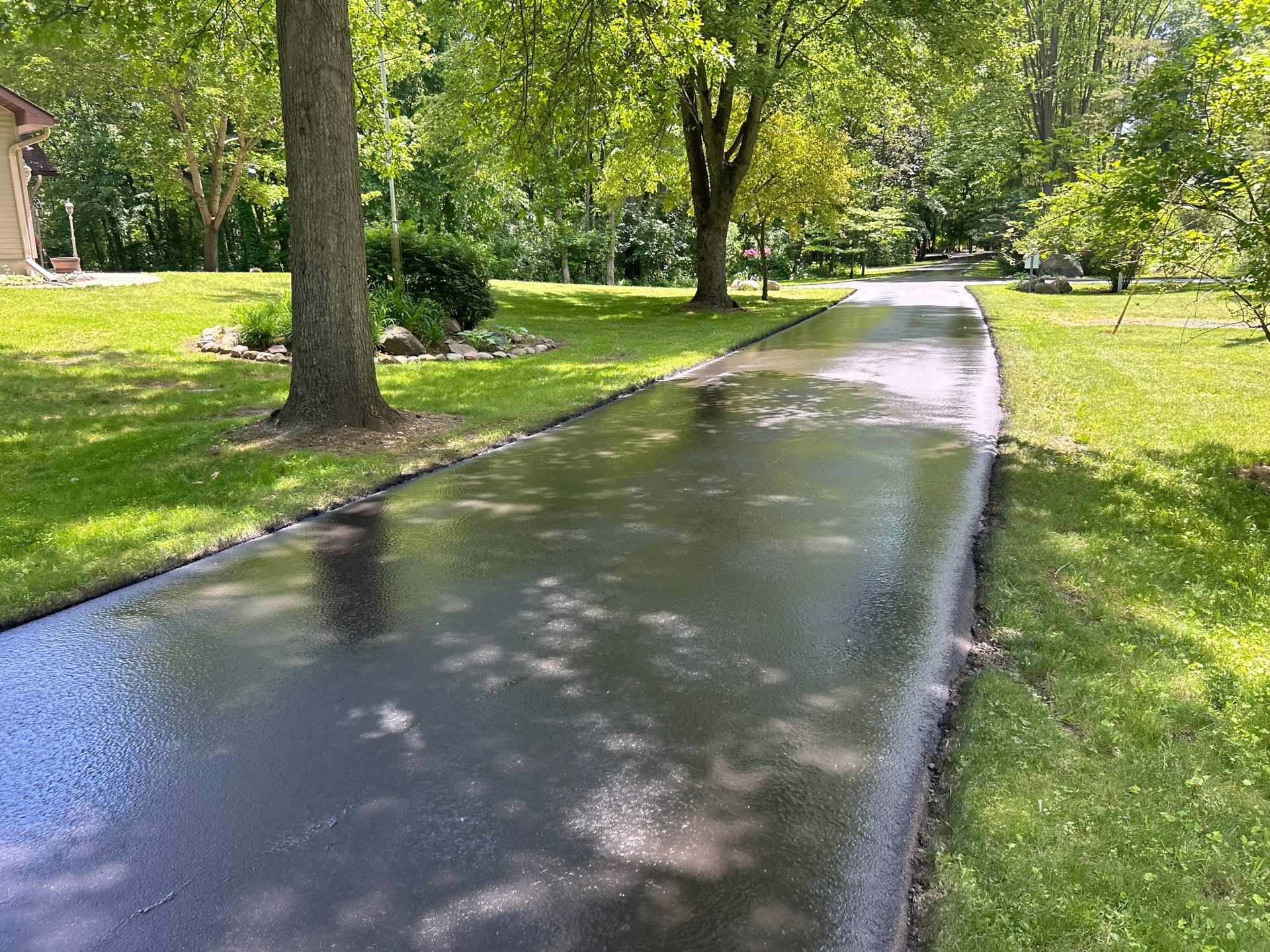 High end residential driveway by Quality Asphalt & Maintenance LLC
