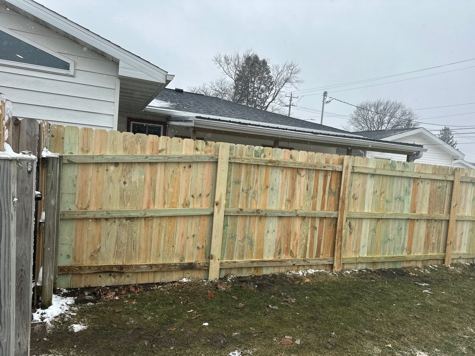 Pressure-Treated Wood Privacy Fence Replacement in Waterloo by Perfect Picket Fence and Stain