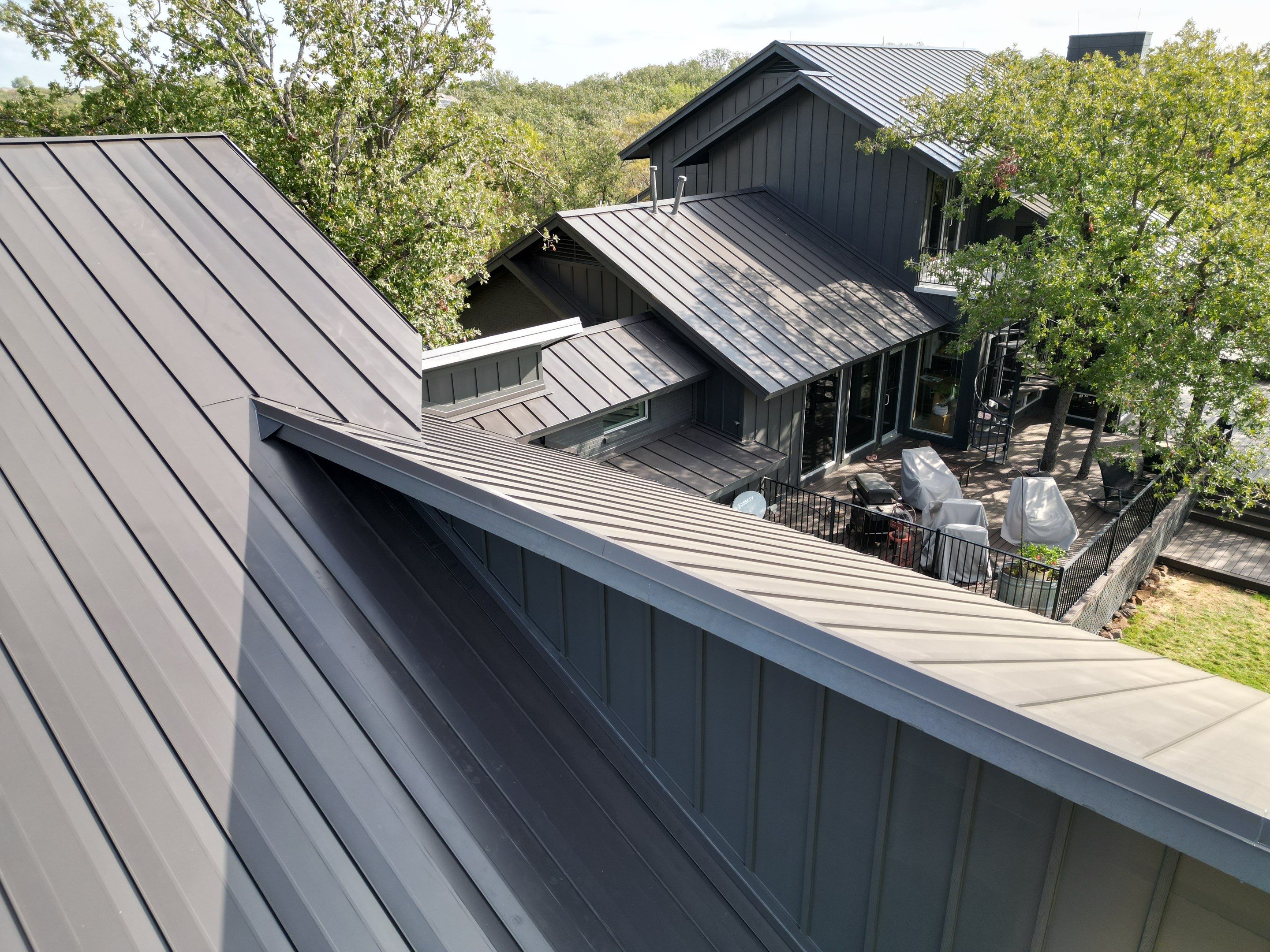 Dark Bronze Standing Seam Metal Roof by First Out Roofing 