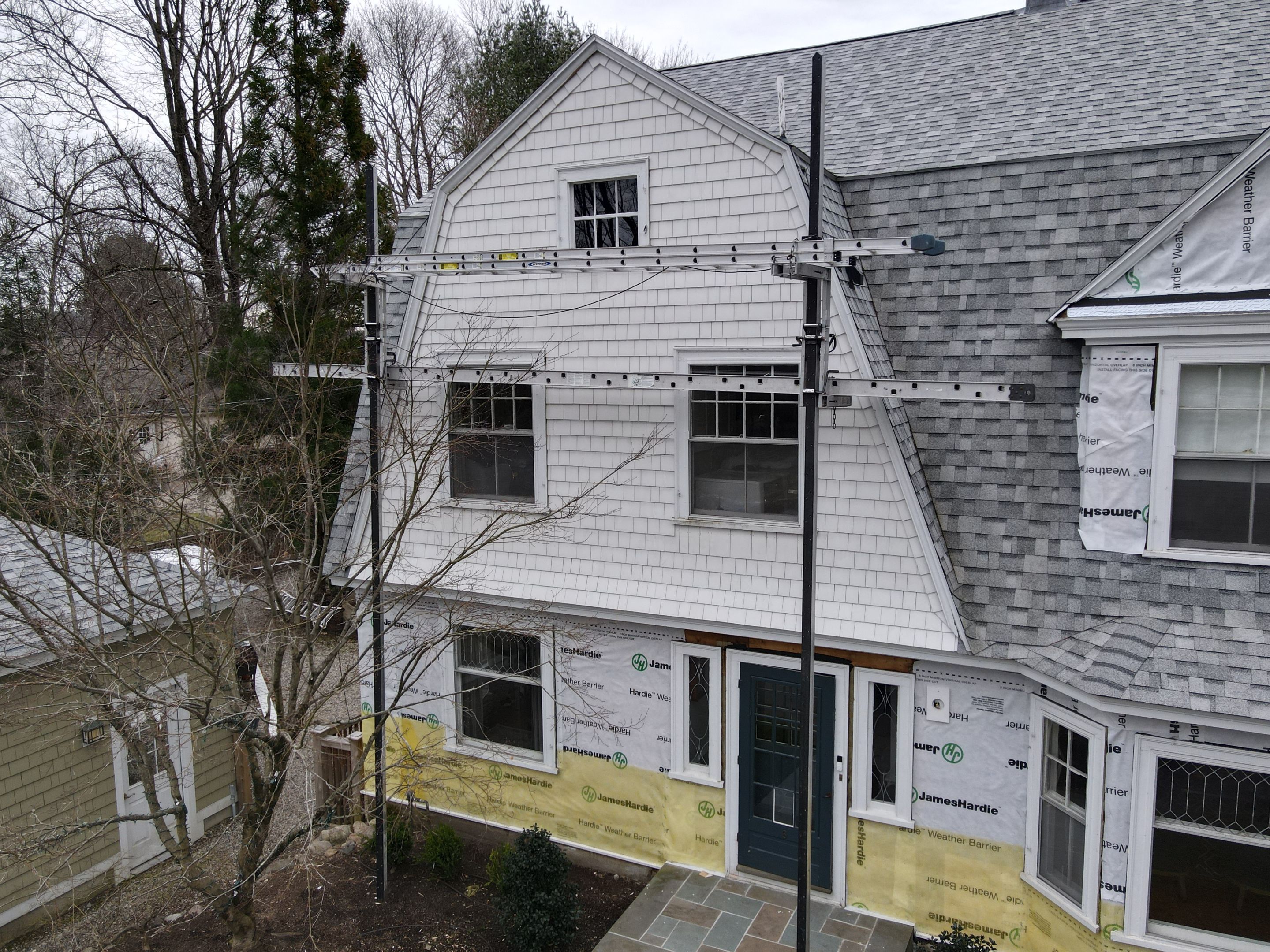 White cedar shingles and windows in Wayland, MA by UBrothers Construction