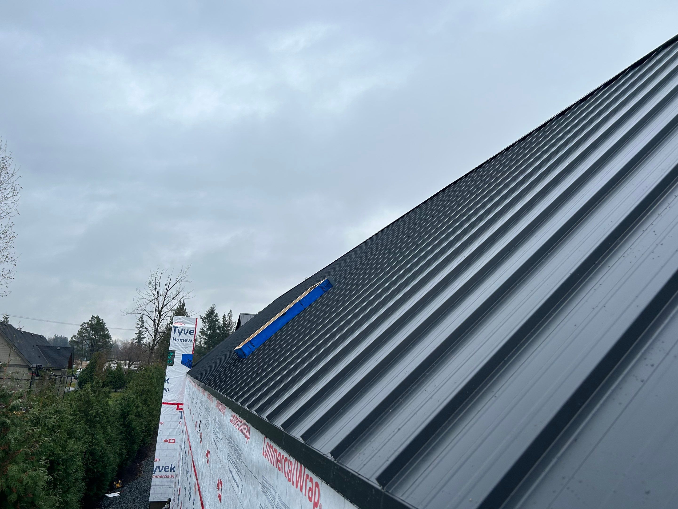 Residential Roofing and siding Installation using 12" Prolok metal  by Top Notch Roofing Inc