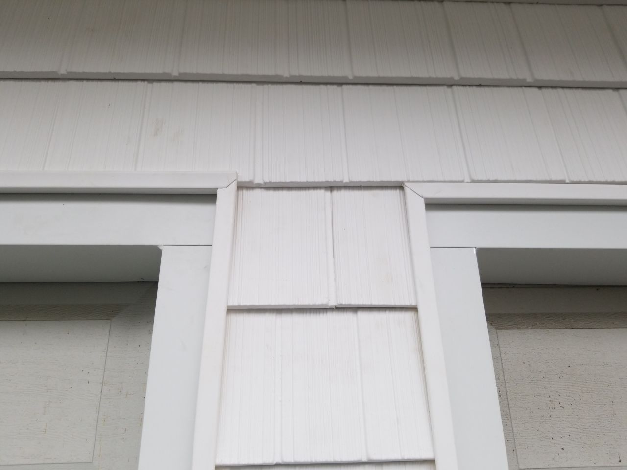 Residential Roofing Installation, Dec-tek walk-out porch roof, siding on garage by Absolute Roofing and Construction