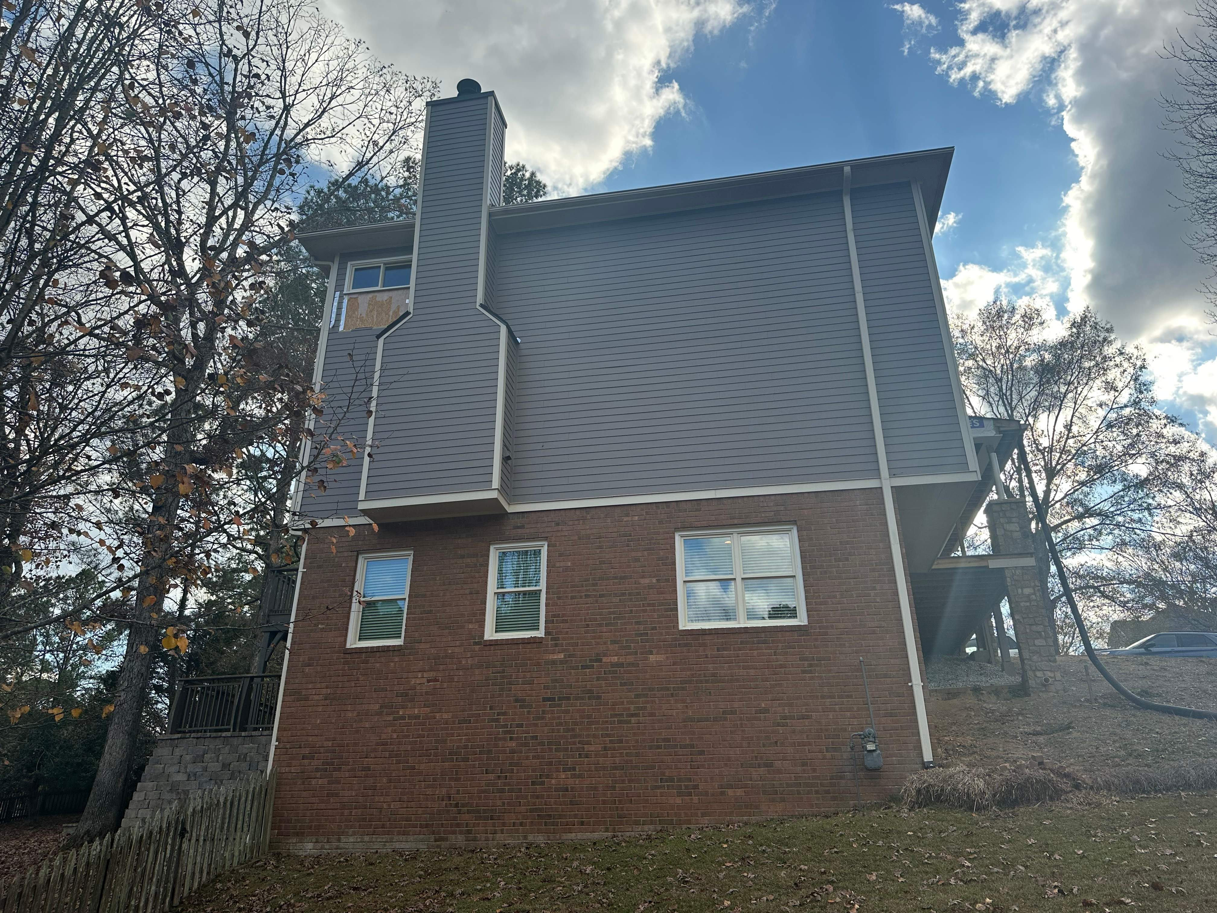 James Hardie Siding Replacement, Exterior Painting, Deck Stain, and Gutter Installation in Peachtree Corners, GA by Nelson Exteriors