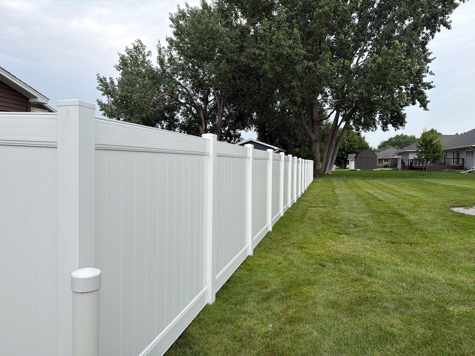 White Vinyl Privacy Fence and Double Gate Installation in Jesup by Perfect Picket Fence and Stain
