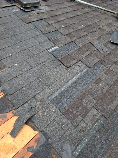 roof replacement and new black gutters by Nailed It Roofing & Remodeling LLC