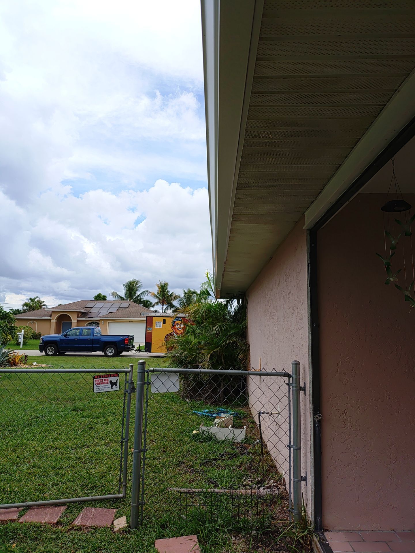 Replace gutter using White Down Spouts in Cape Coral FL by Gutter Professors