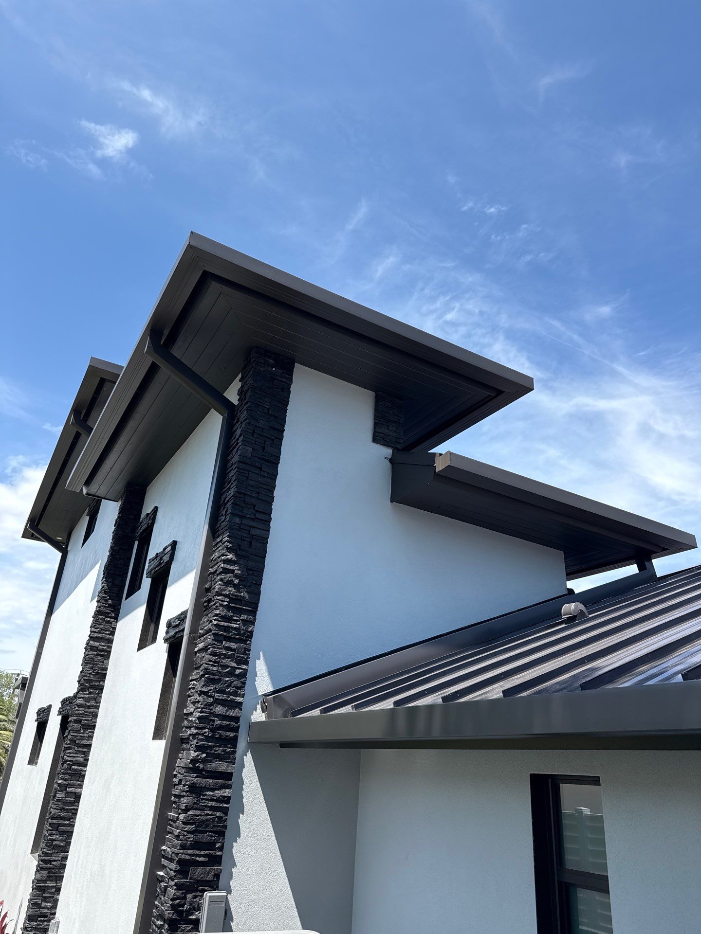 7-Inch Smooth Box Seamless Gutters using black seamless gutters in Siesta Key Fl by Gutter Professors