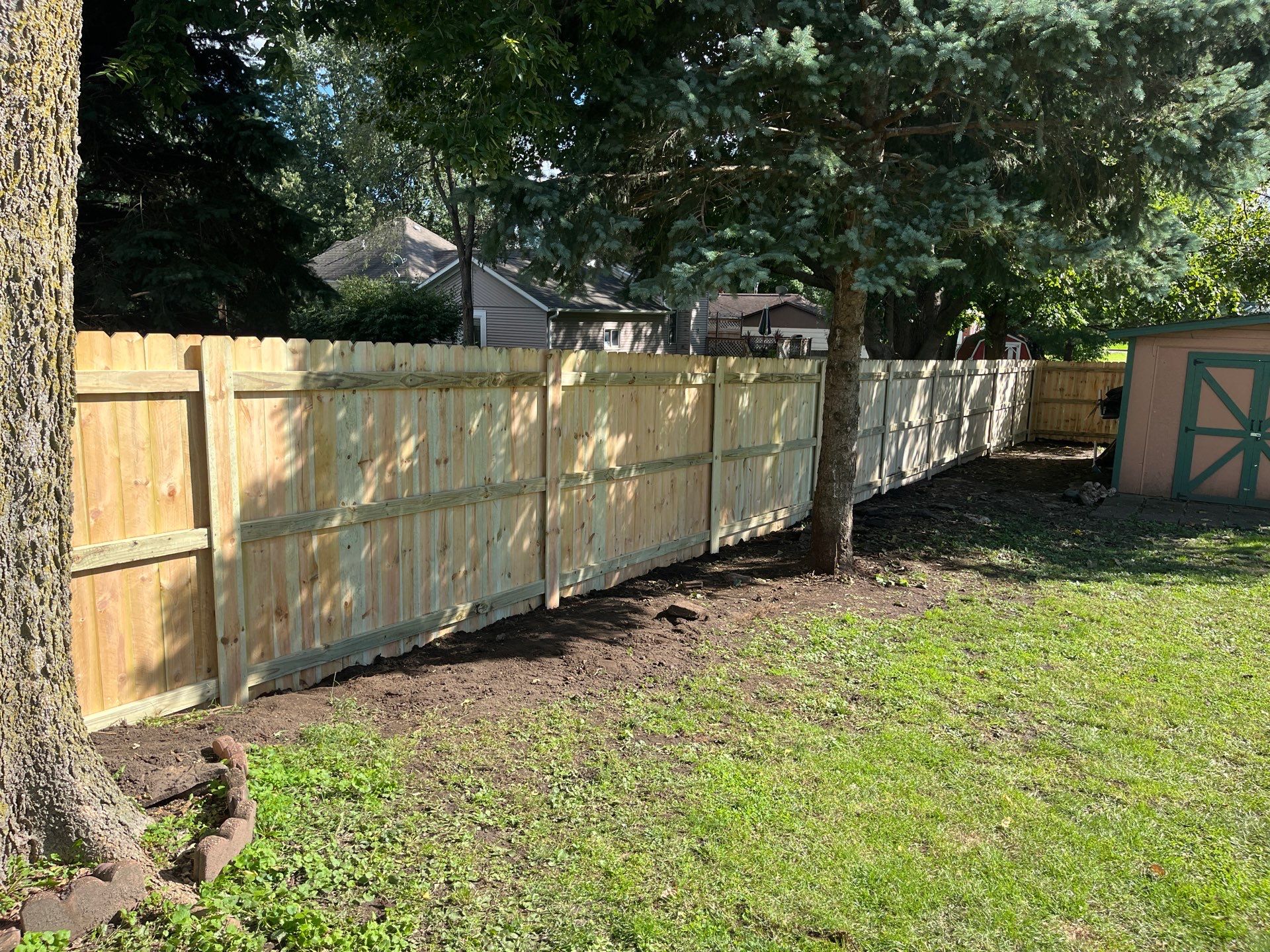 Pressure-Treated Wood Privacy Fence Installation in Waverly, Iowa by Perfect Picket Fence and Stain