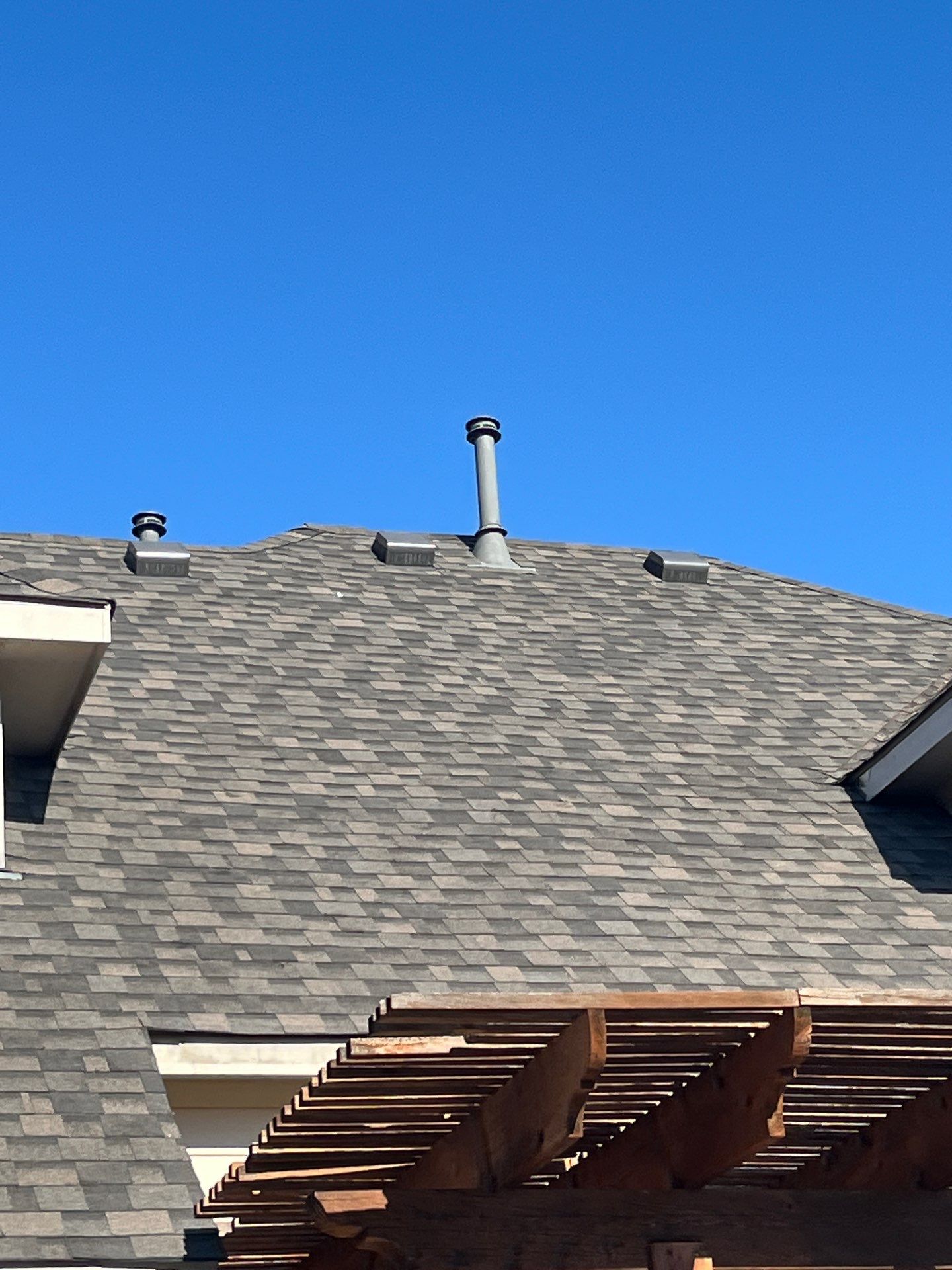 IKO Cornerstone-Dark Reddish Brown brick house  by Tejas Roofworks + Restoration