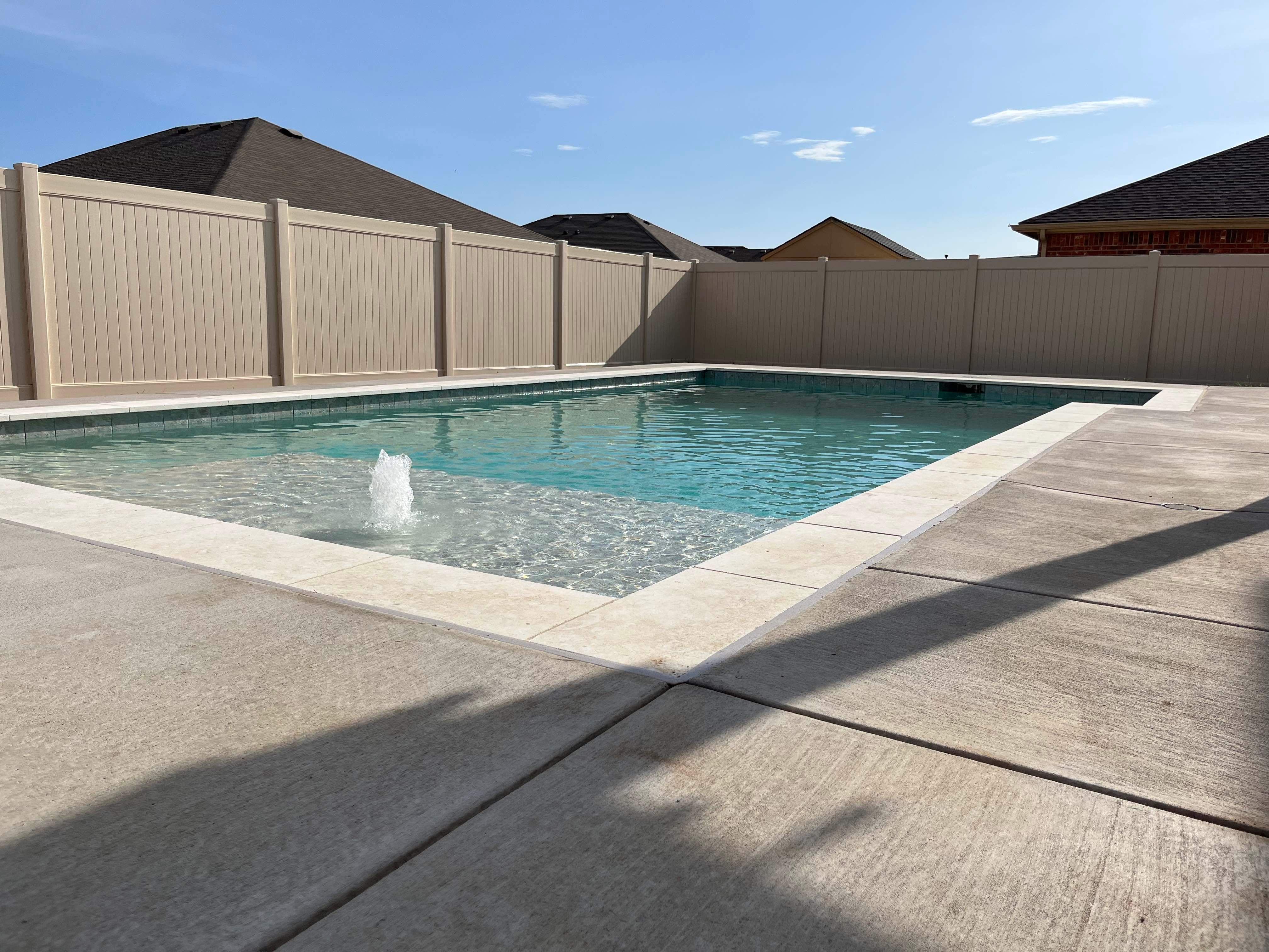 Geometric Pool with Tanning Ledge by Pinnacle Pools and Spas - DFW