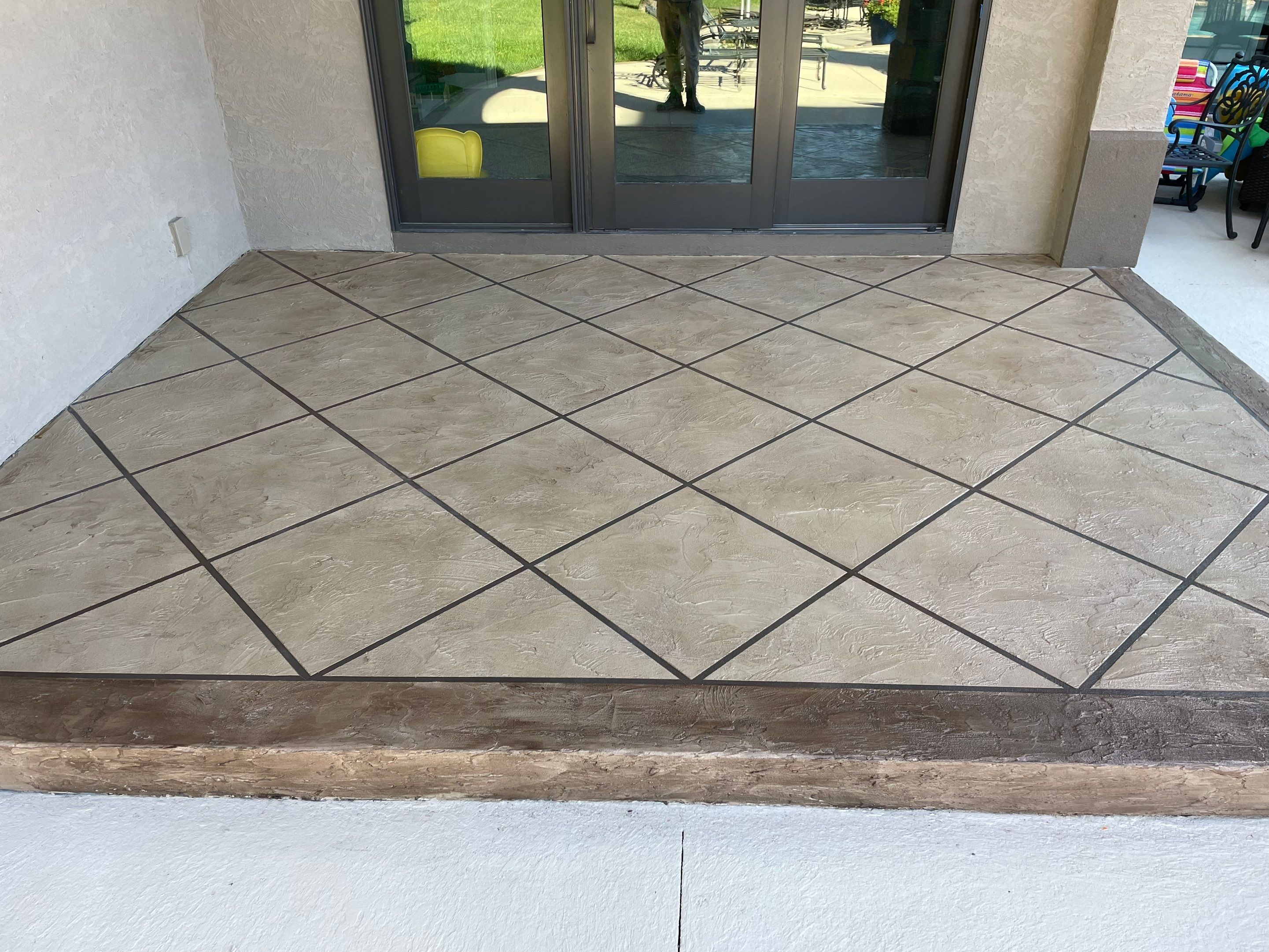 Lake Lotawana -- Front Walkway and Back Patio Tuscan Overlay by Big Red Decorative Concrete, LLC