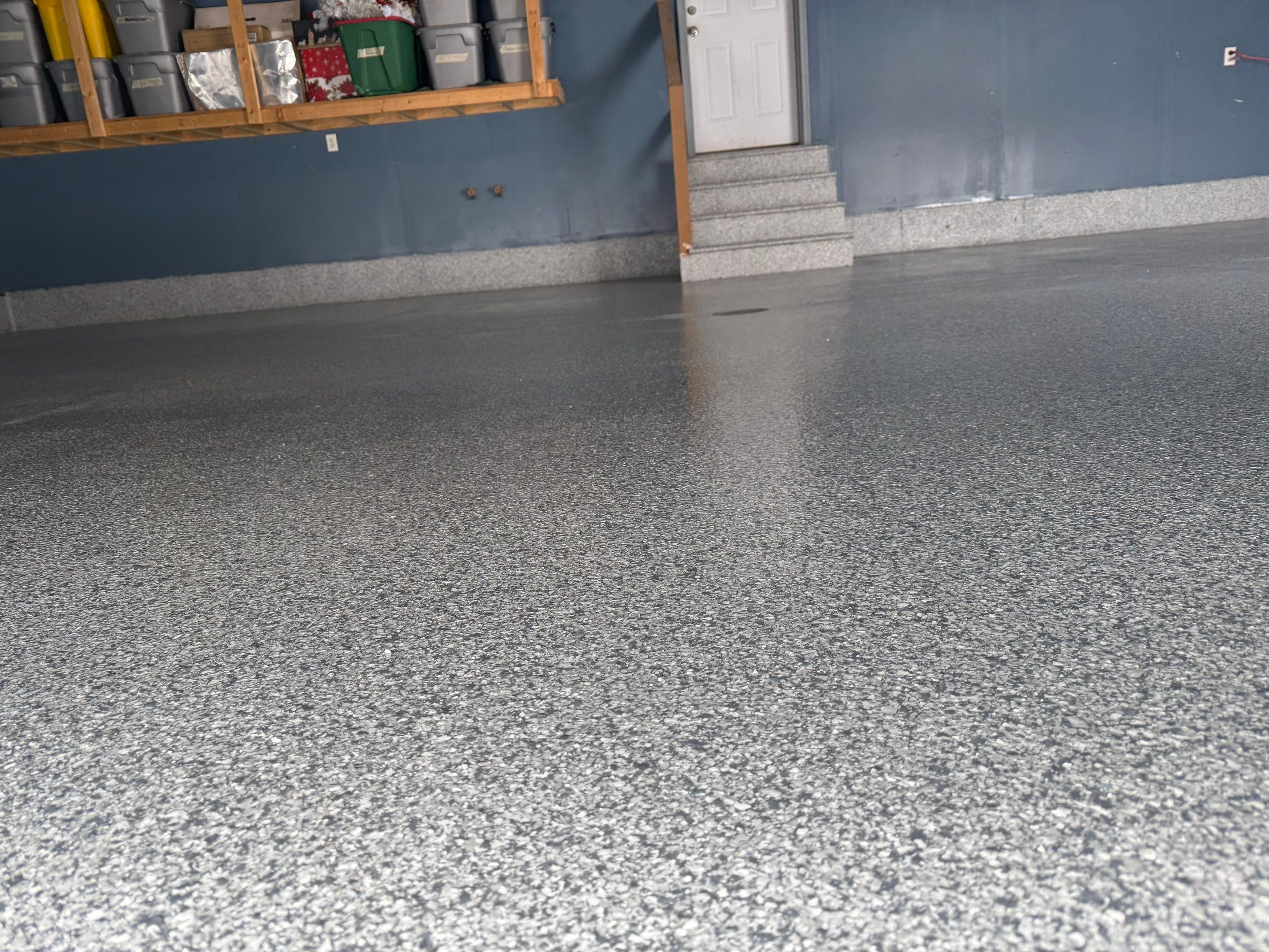 Grey Speckled Epoxy Garage Floor and Stair Coating in Sioux Falls by Select Painting, Coatings & Garage Cabinets