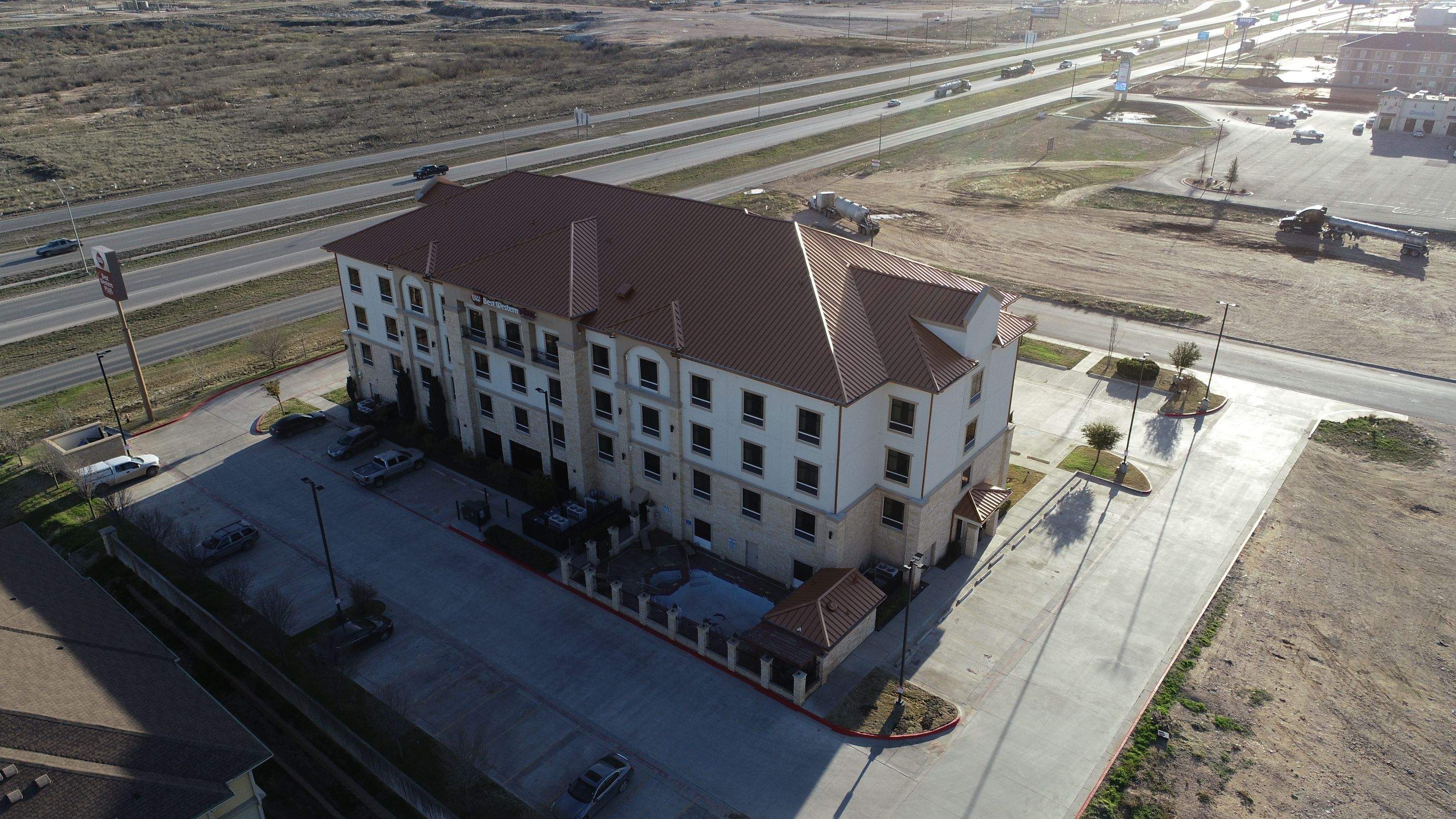 Commercial Roof Replacement for Best Western using Standing Seam Roofing - Midland, TX by Roof Experts