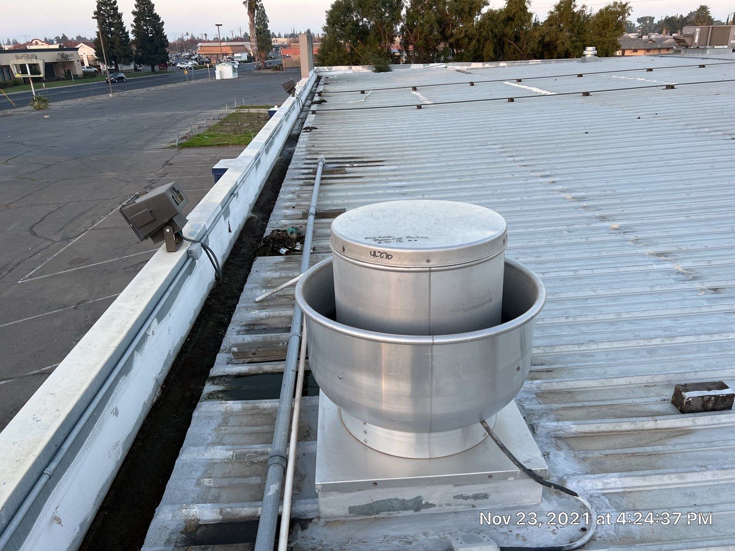 Metal roof restoration on commercial roof using Conklin Benchmark/ PUMA XL acrylic coatings over metal and foam by Straight Edge Roofing Inc
