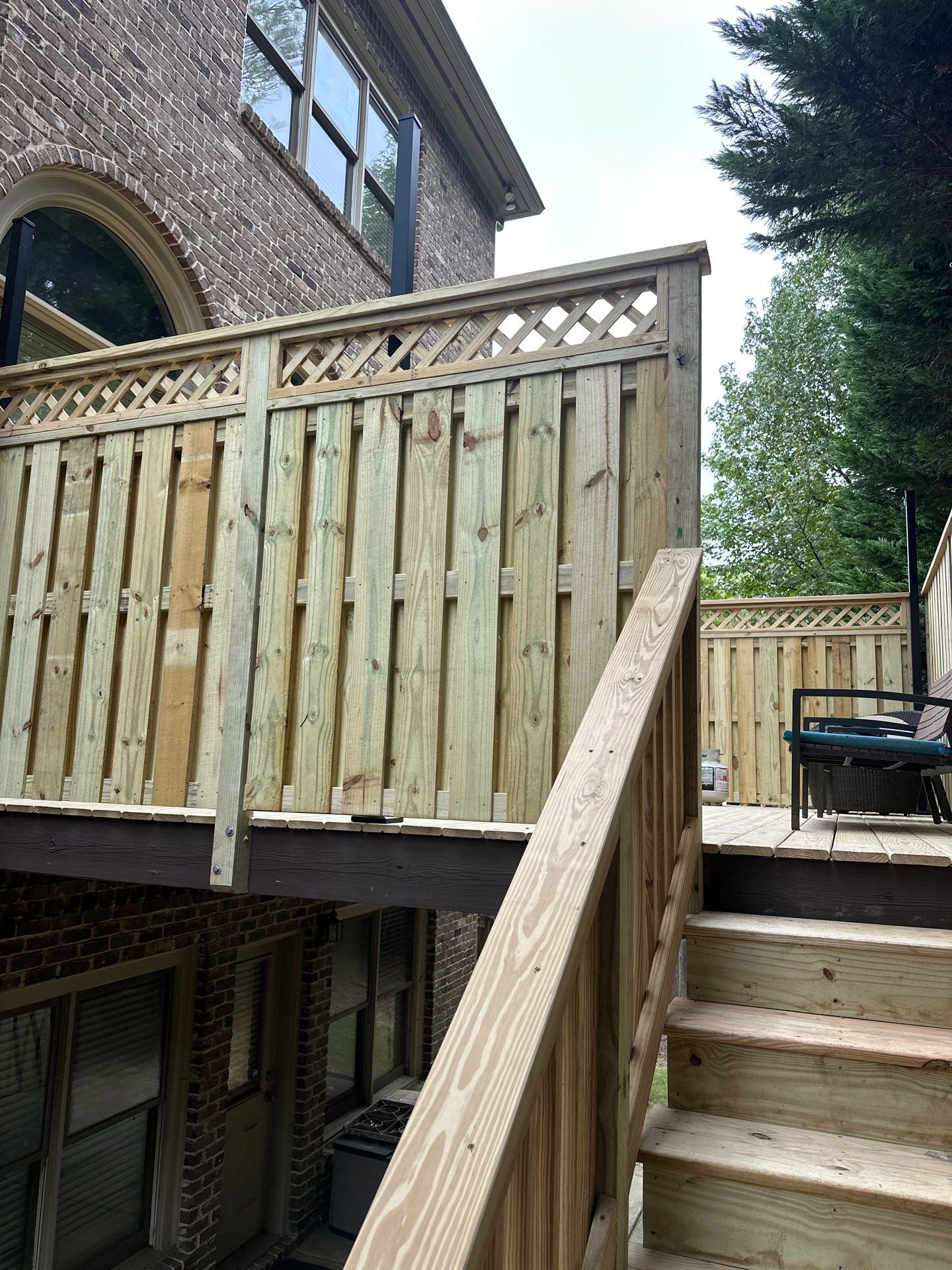 Decatur, GA Deck Resurface and Privacy Wall Build Using Pressure Treated Pine by Nelson Exteriors 