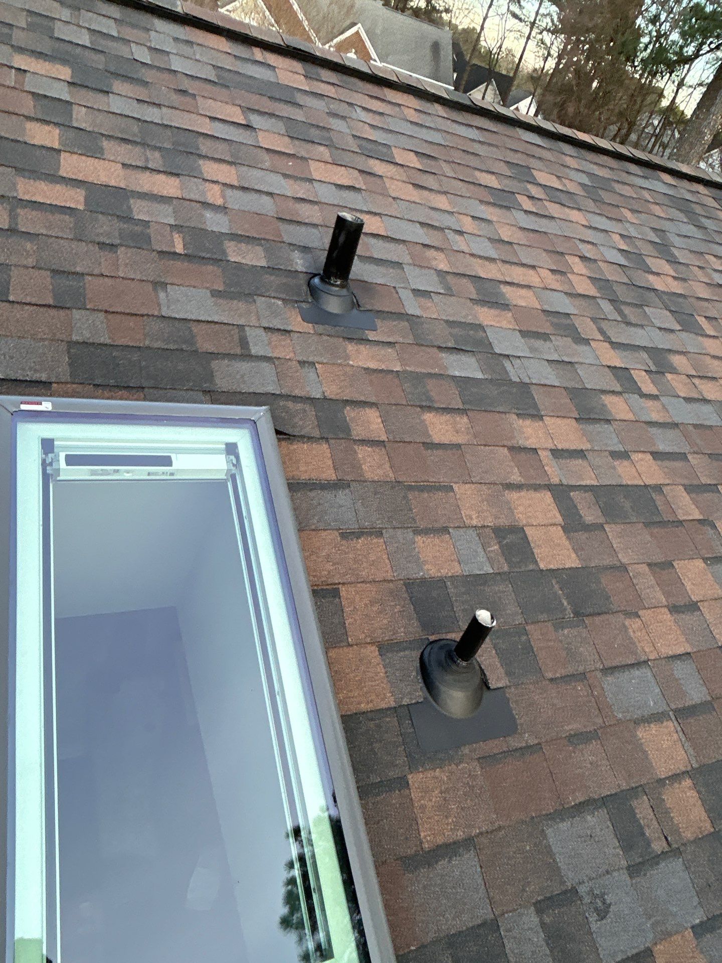 Owens Corning Duration Shingle Roof Replacement and Velux Skylight Installation in Charlotte by Merritt Roofing LLC