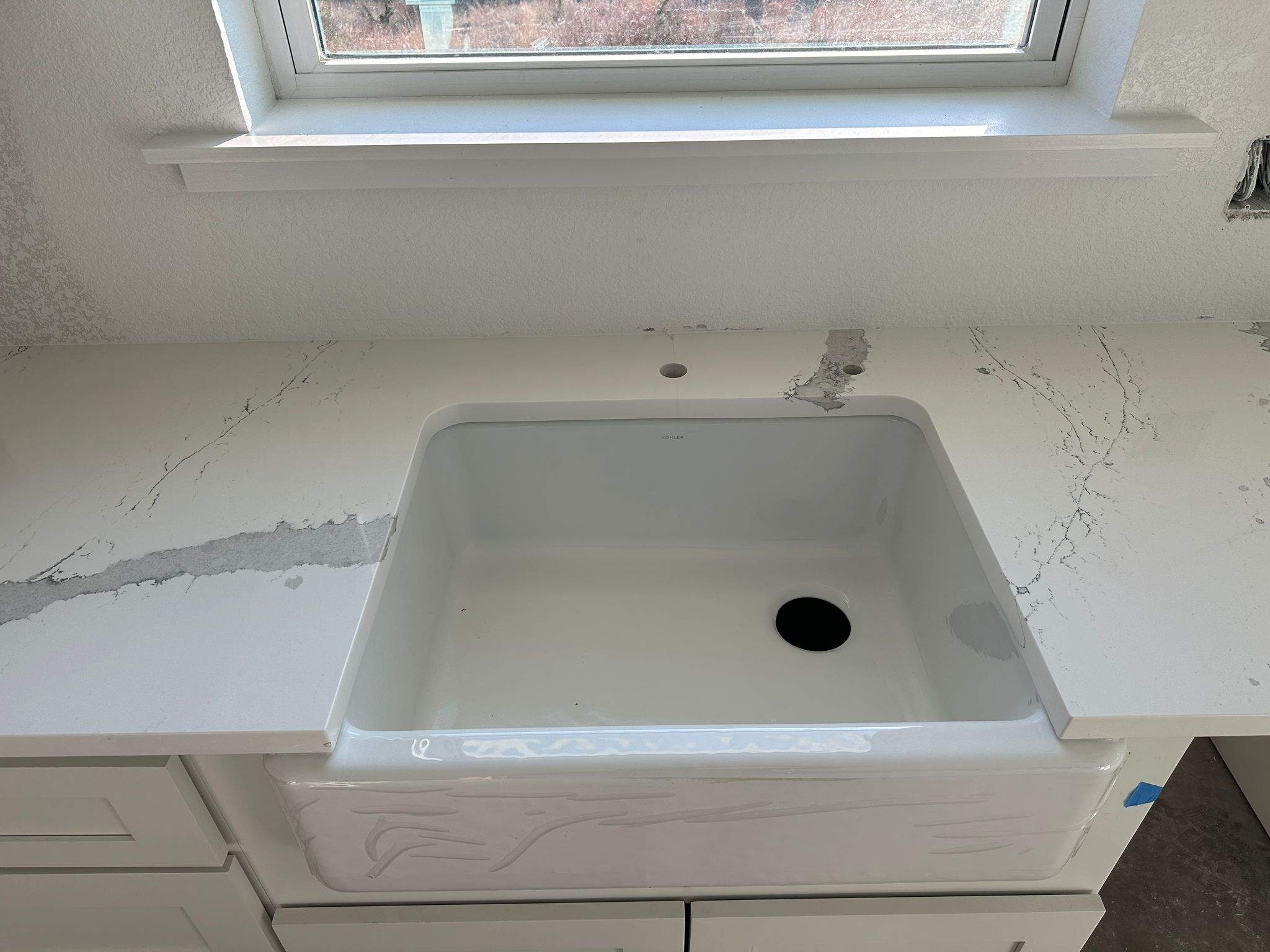 Kitchen and Bathroom Countertop Upgrades Featuring Gray Veined Quartz by Mena stone surfaces