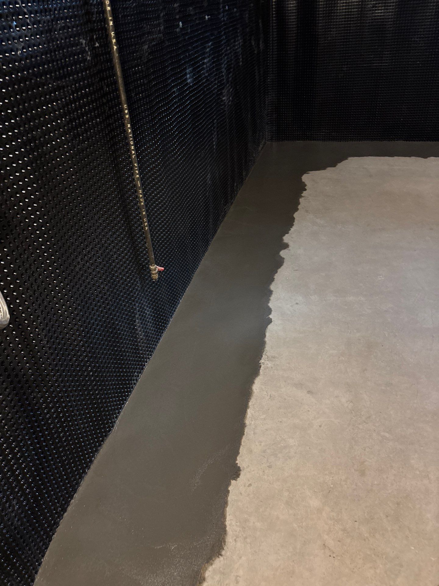 Interior Drain Tile & Buried Discharge in South Minneapolis by Waterproofing Northeast