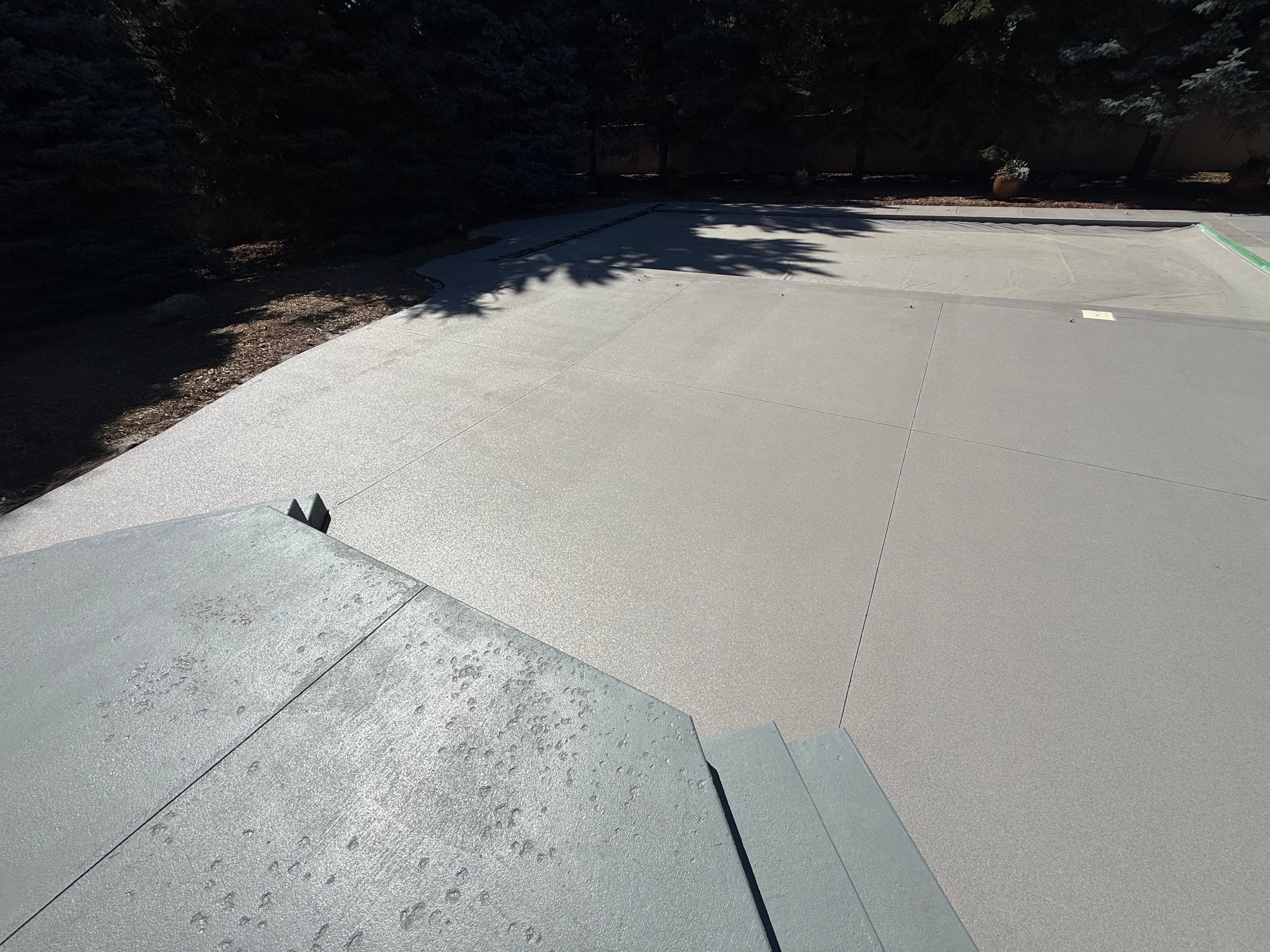 Decorative Concrete Pool Deck and Patio Resurfacing in Sioux Falls by Select Painting, Coatings & Garage Cabinets