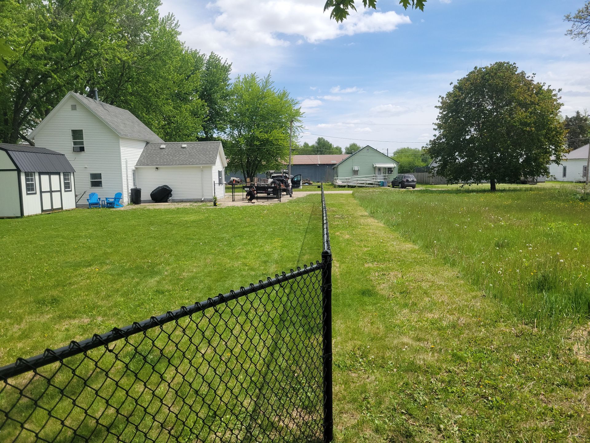 Black Chain Link Fence Installation and Gate in Traer by Perfect Picket Fence and Stain