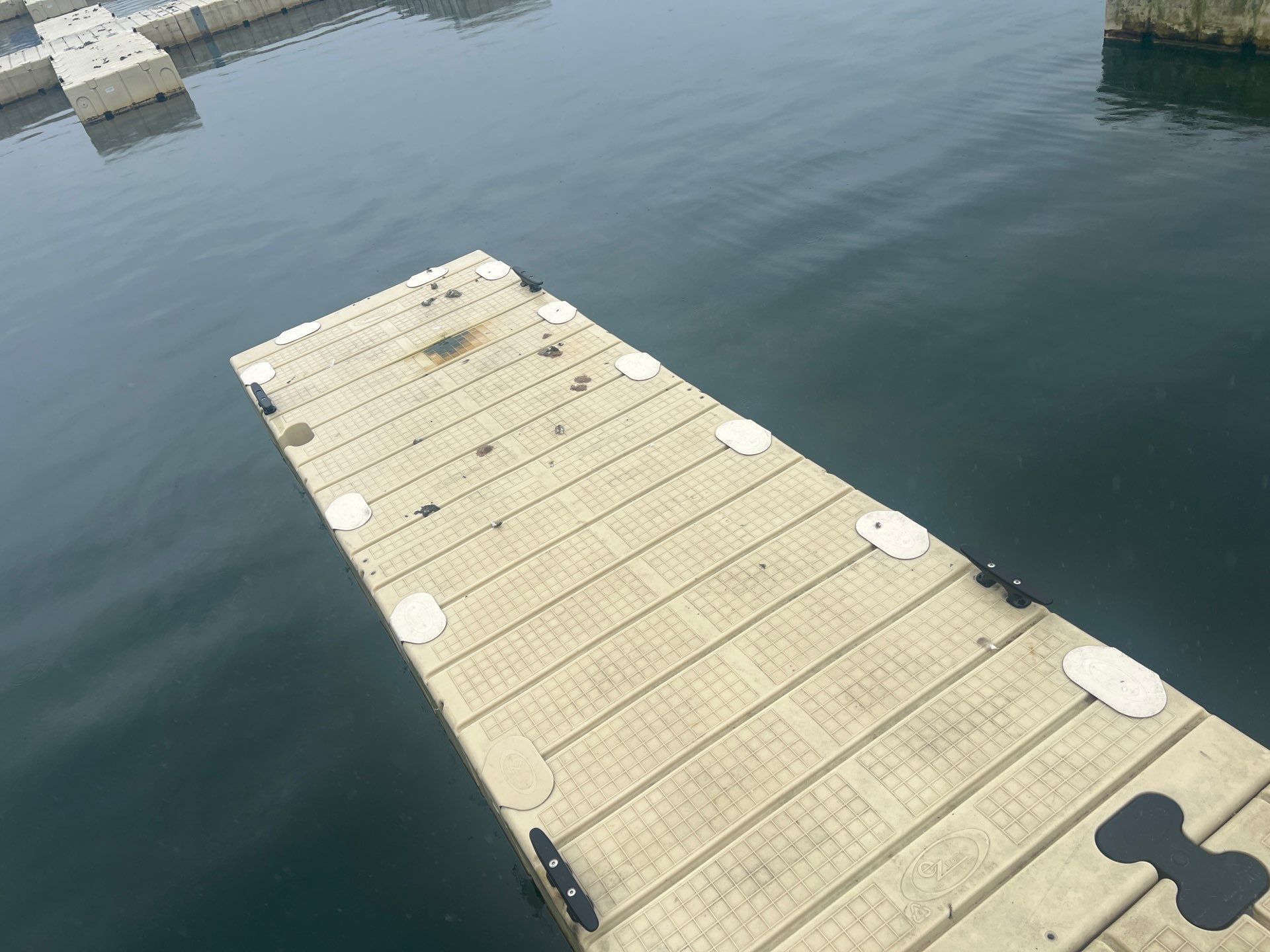 Power washing of floating dock by Northern Power Washing LLC.