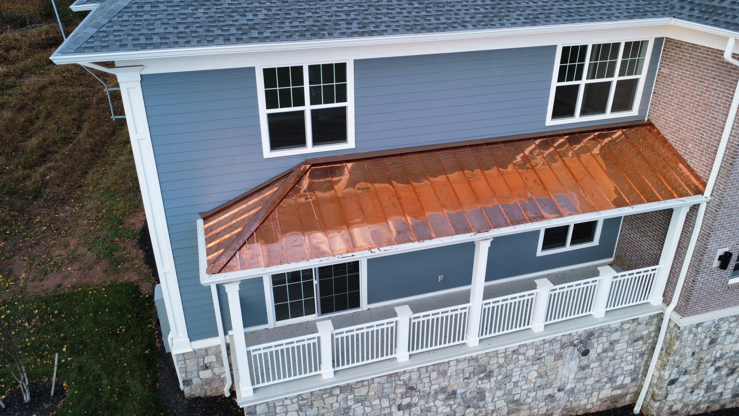 Standing Seam Metal Roof using Copper by CMNG LLC