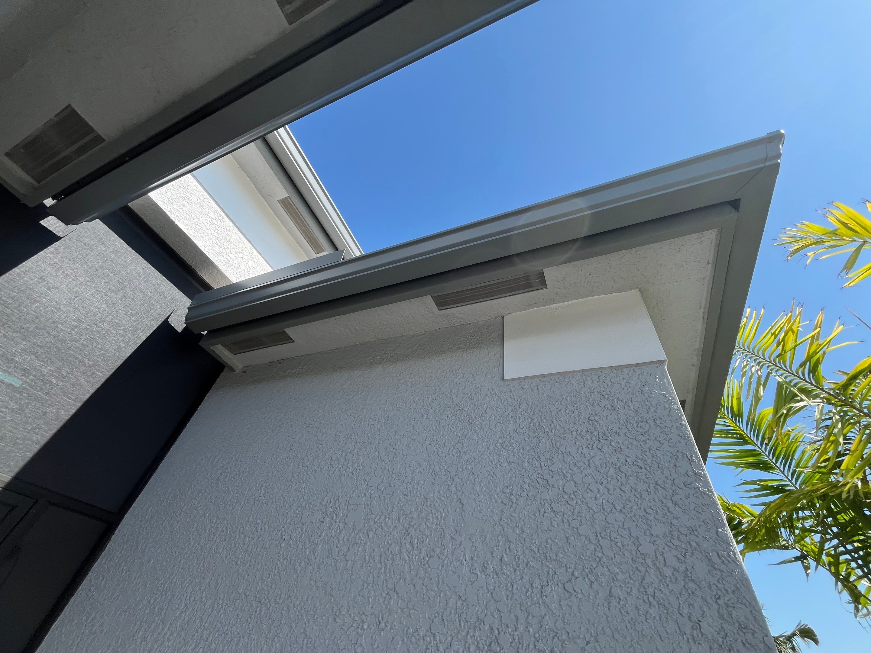 Grey Seamless Gutter Installation in Estero FL by Gutter Professors