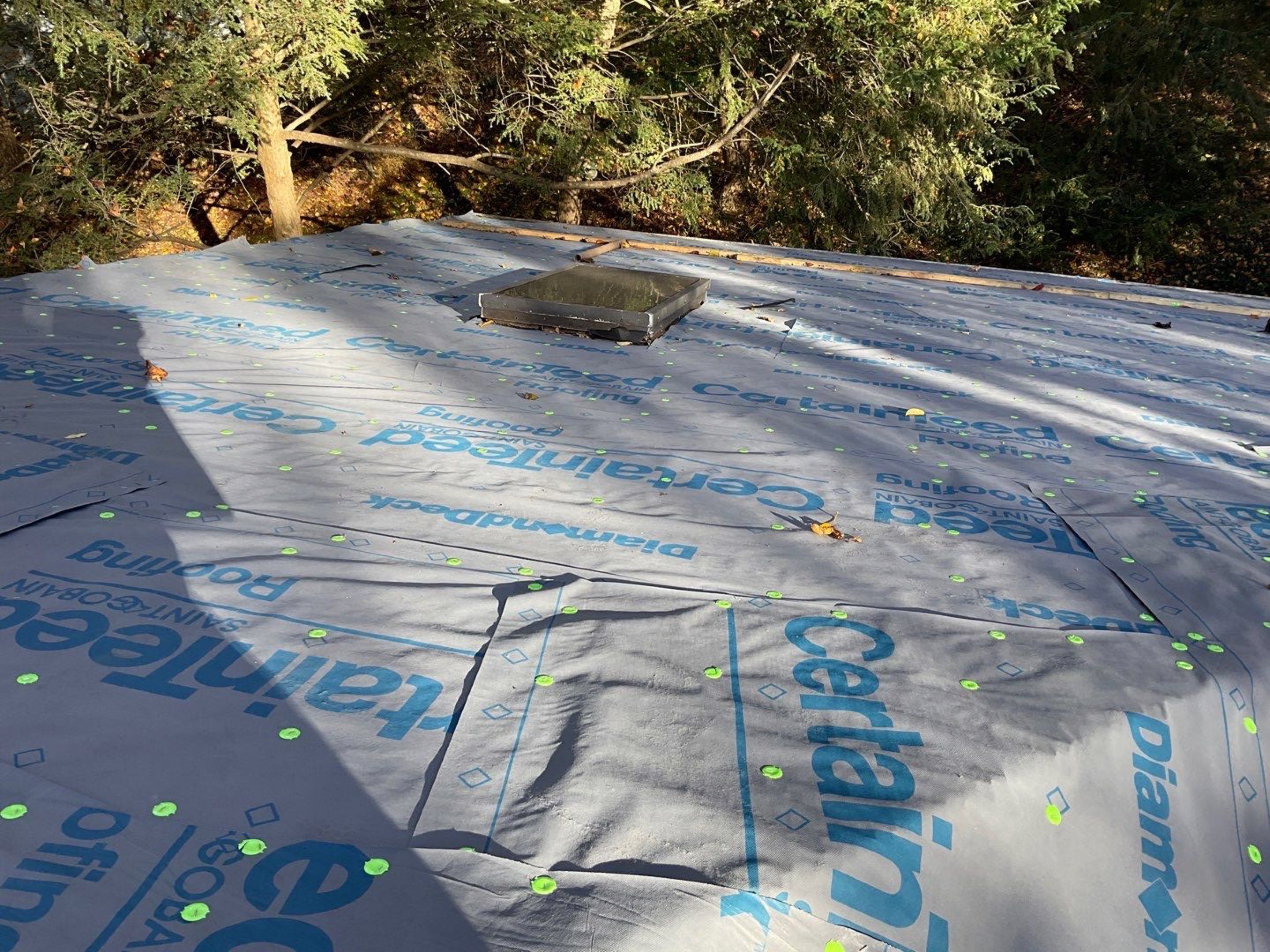 Install new shingles and new skylights  by Alpha Design Services