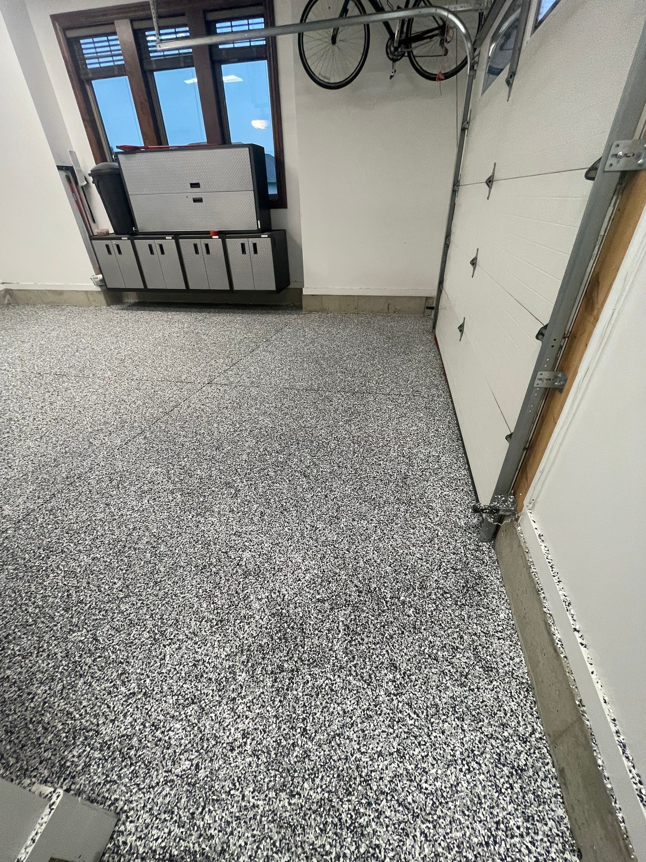 Garage Floor Coating and Domino Flake Finish in Sioux Falls by Select Painting, Coatings & Garage Cabinets