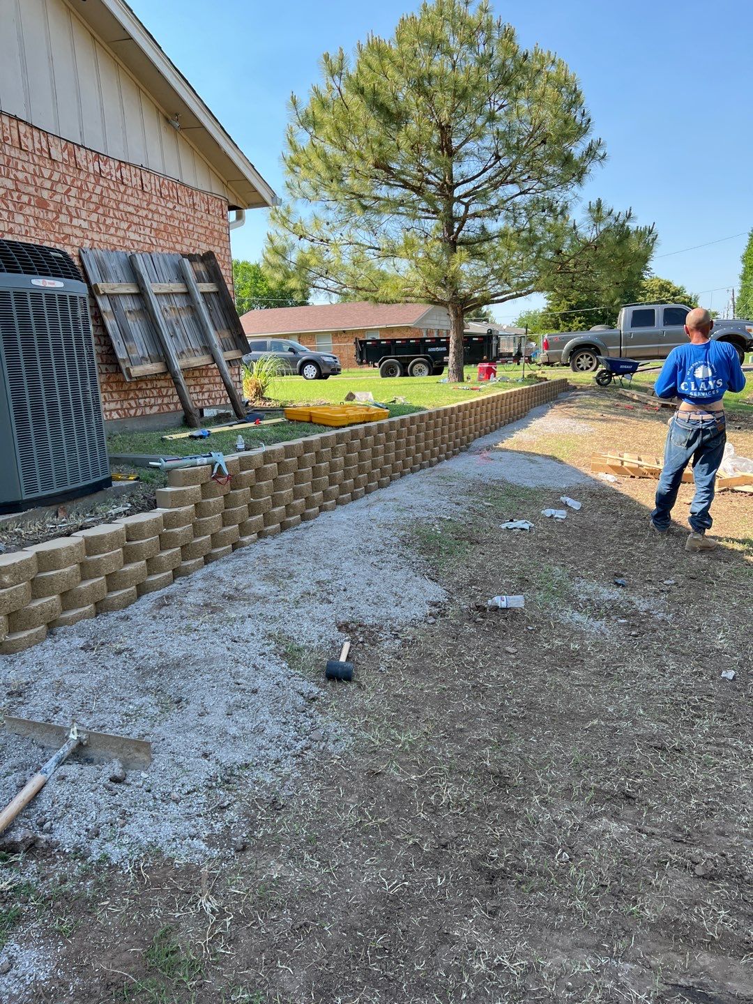 Retaining Wall using Rocks by Clays Services Inc