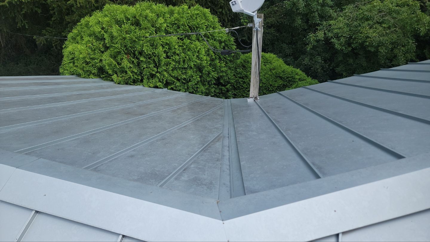 roof washing using Algaecide, soft wash soap by Northern Power Washing LLC.
