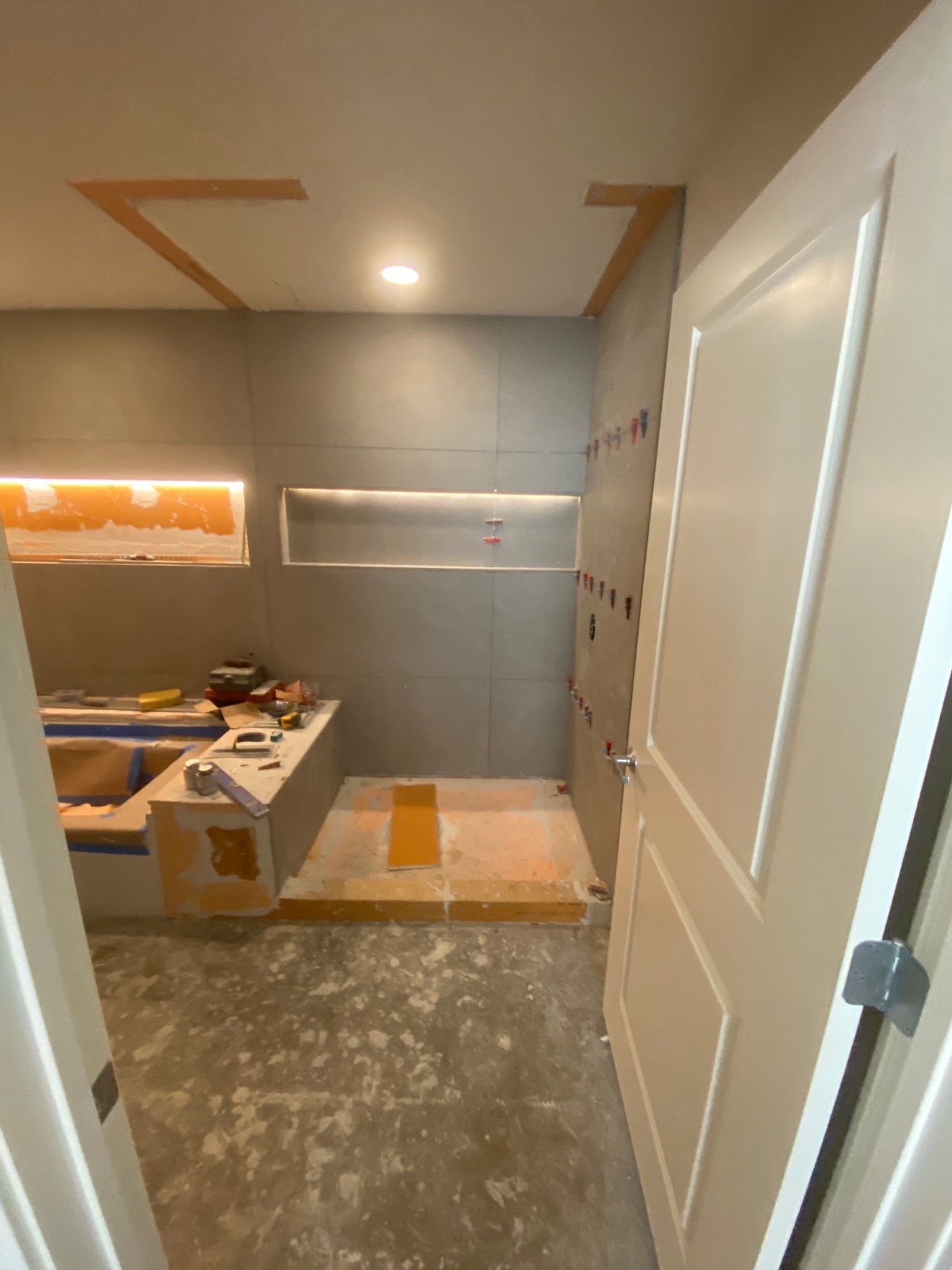 Modern Bathroom Transformation by Fine Line Flooring Inc.