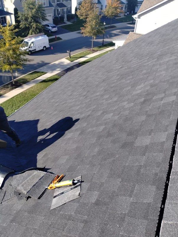 Residential Roofing Installation using Atlas Pinnacle Pristine Black Architectural Shingles by Frederick Roof Repair