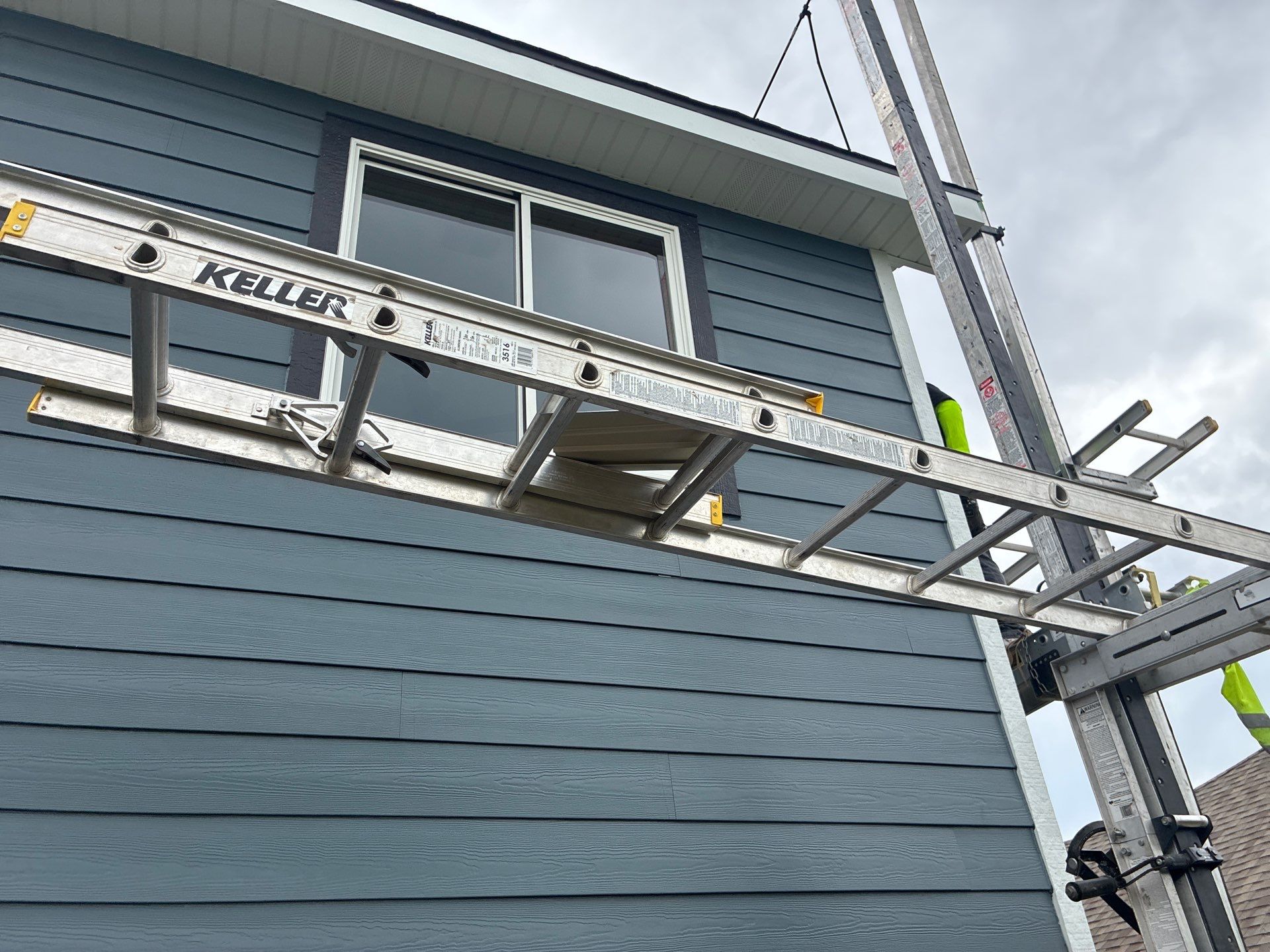 James Hardie Siding and Window Replacement with Arctic White Trim by Carps Complete Exteriors