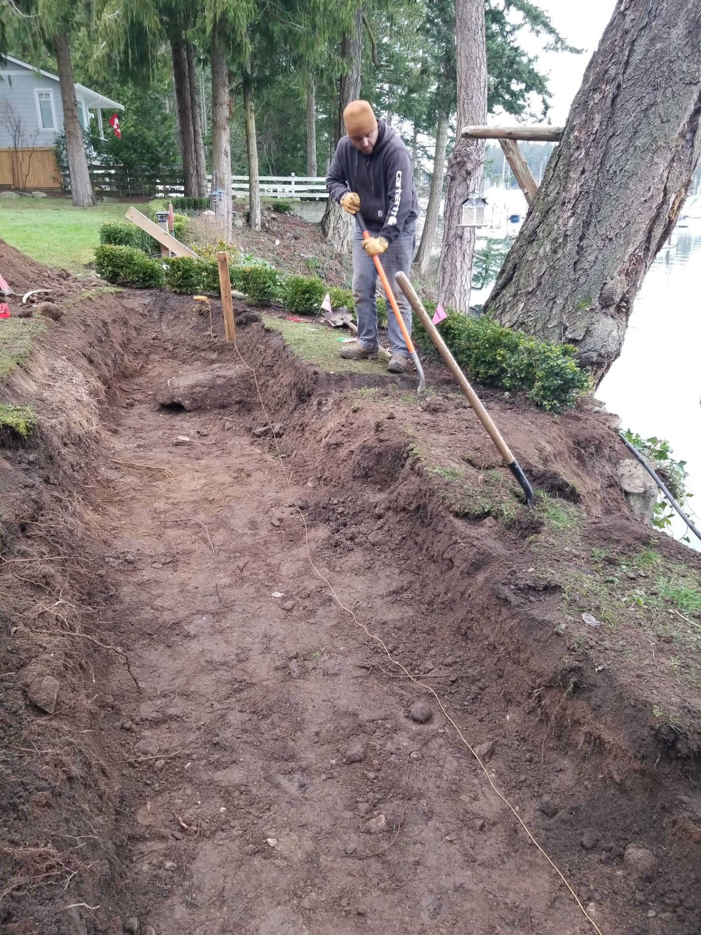 Coastal Landscape Restoration & Retaining Structure - In progress by Habanero Garden and Exterior Care