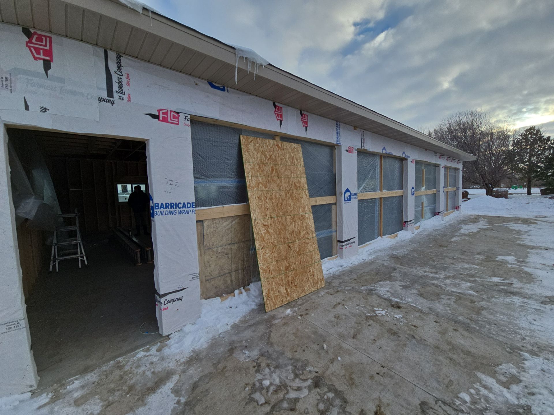 Speckled Epoxy Floor Coating for Large Shop in Rock Valley by Select Painting, Coatings & Garage Cabinets