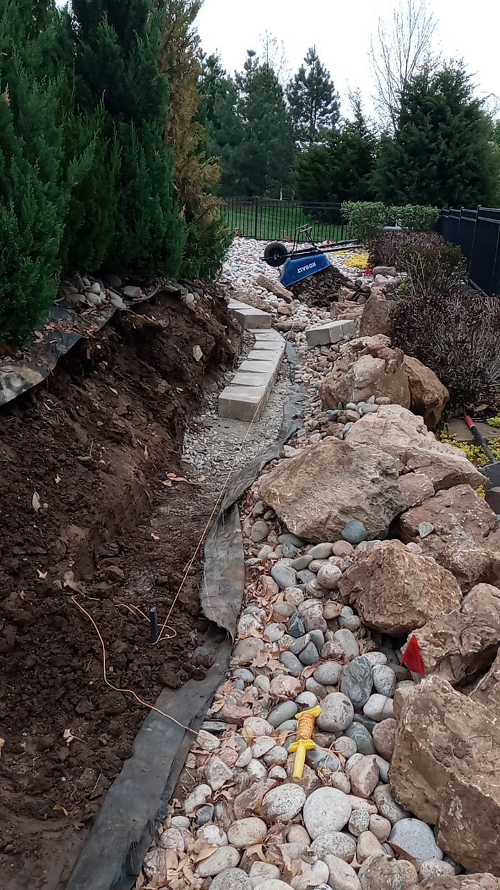 Pool Retaining Wall by LAND ESCAPES LLC