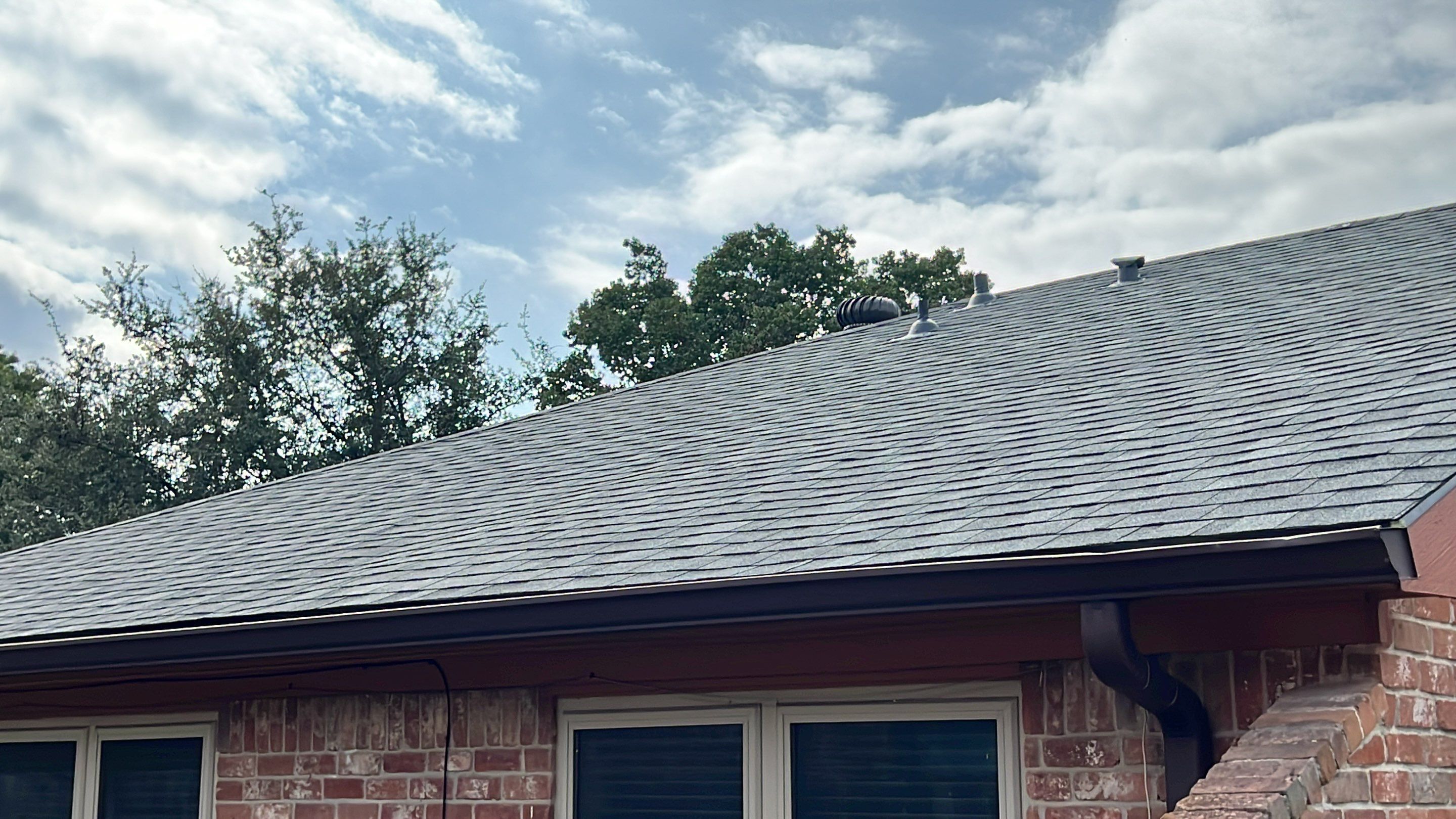 New Gray Shingle Roof on Brick Home — Houston, TX by PL Roofing & SB Roofing, LLC.