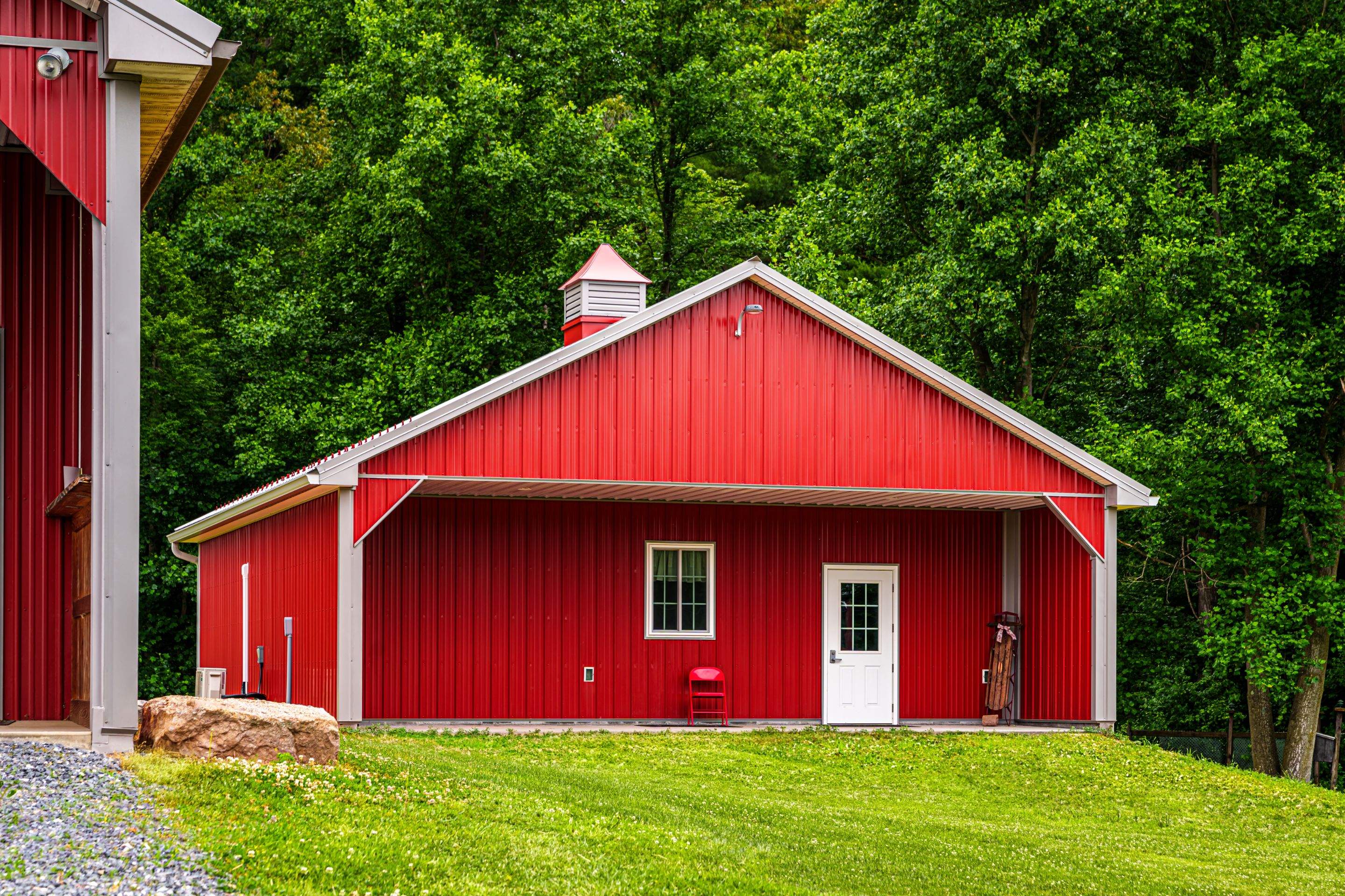 Metal roof -barn red, and New garage by Esh Builders