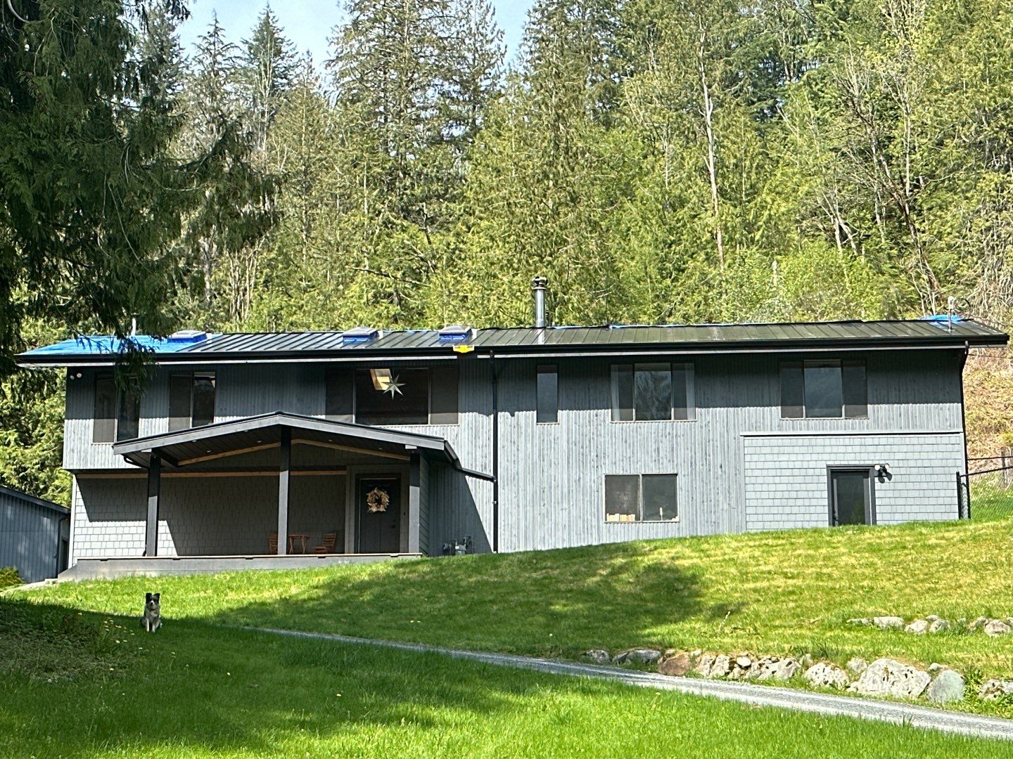 Residential ReRoofing Installation using 12" Prolok metal by Top Notch Roofing Inc