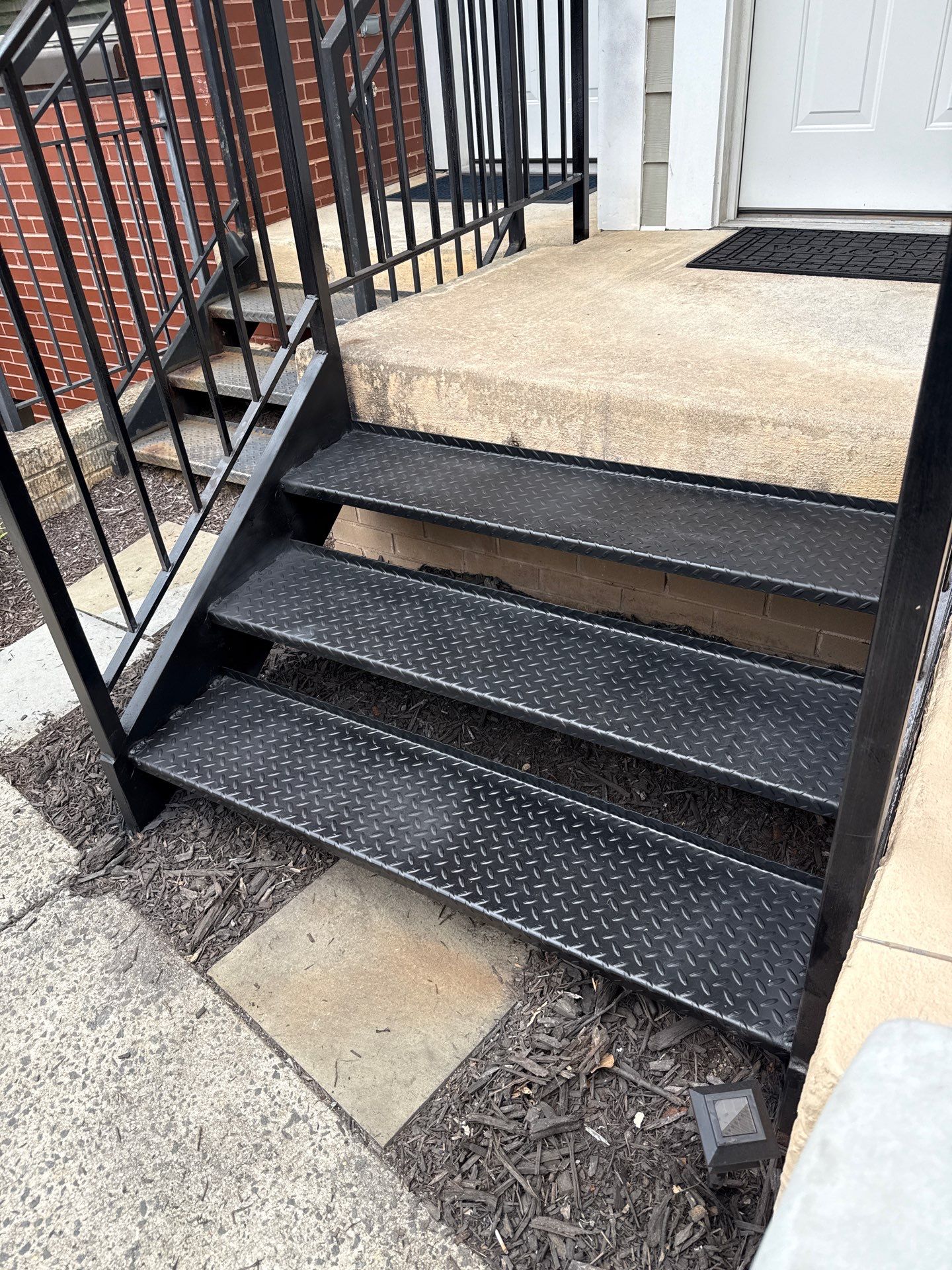 Black Metal Diamond Plate Staircase Restoration in Washington, DC by Capitol Iron Works