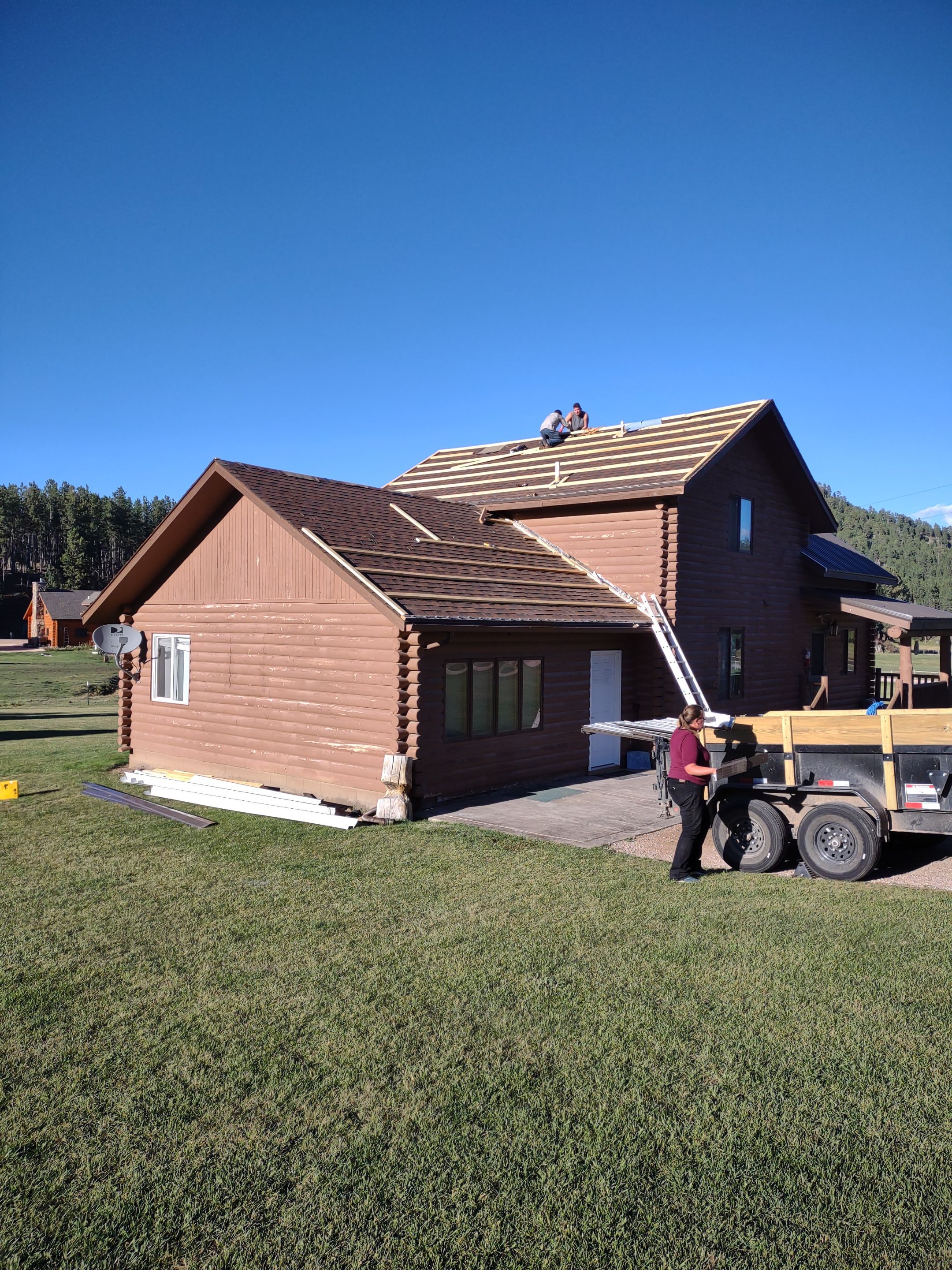 Hill Country Guest Ranch using Steel Roofing, Gutters, Log Cabin Staining by Lightning Exteriors