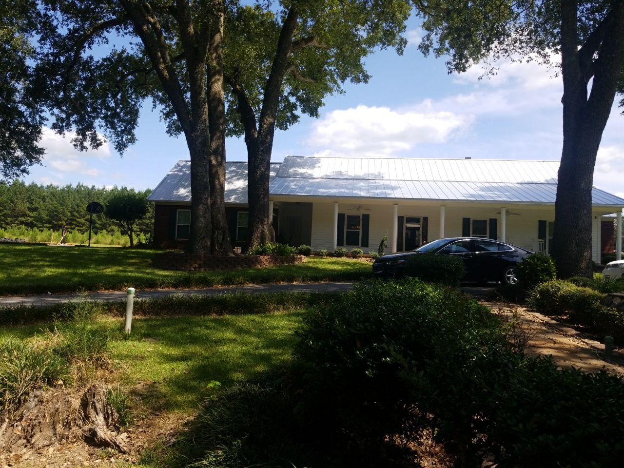 Residential Roofing Installation using Metal roofing by American Roofing & Construction LLC