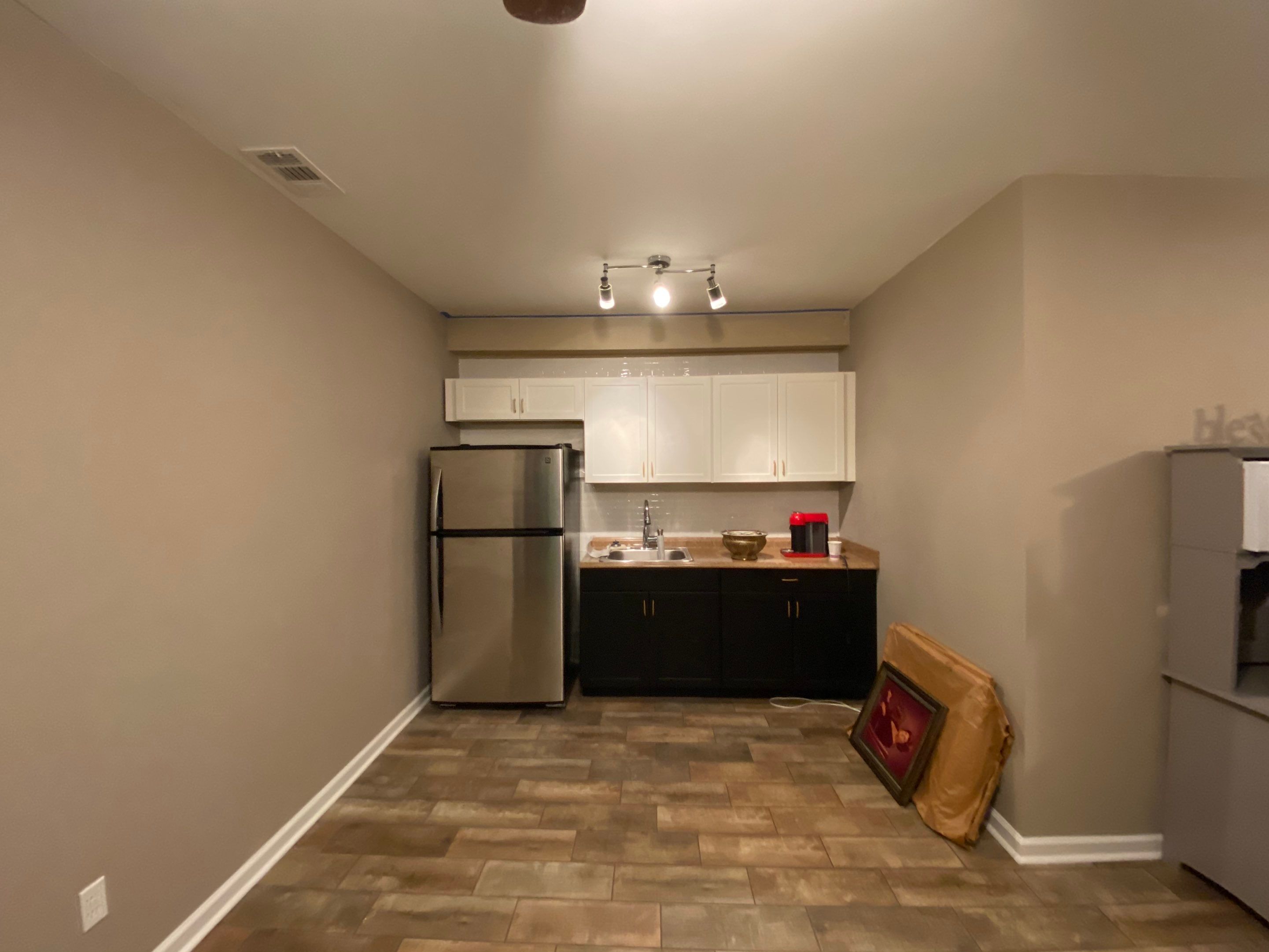 Woodstock Basement Kitchen Remodel with Custom Cabinetry and Tile Flooring by Swift Home Renovations