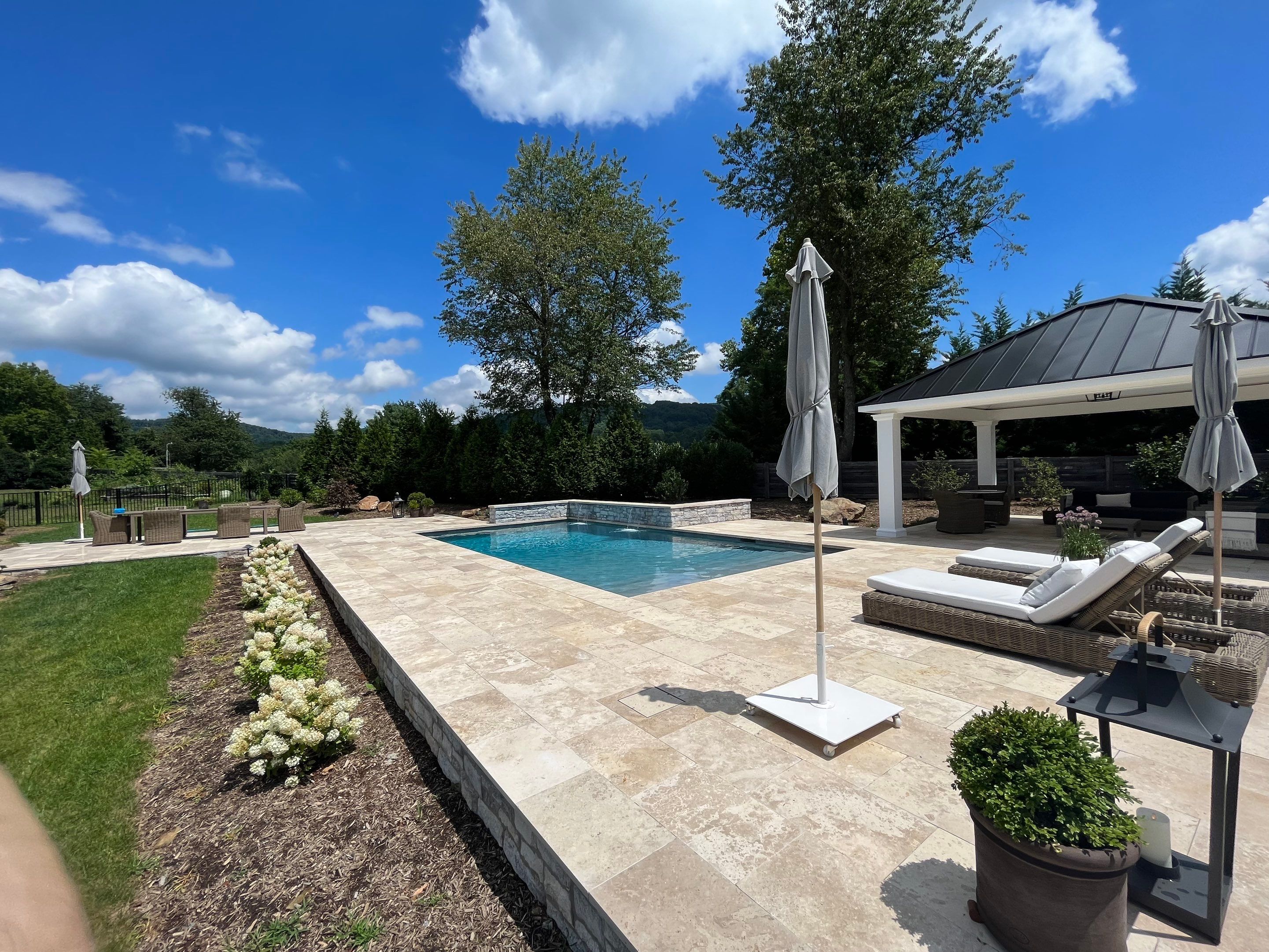 Gunite Pool w/ Raised Wall and Waterfalls by Elysium Pools