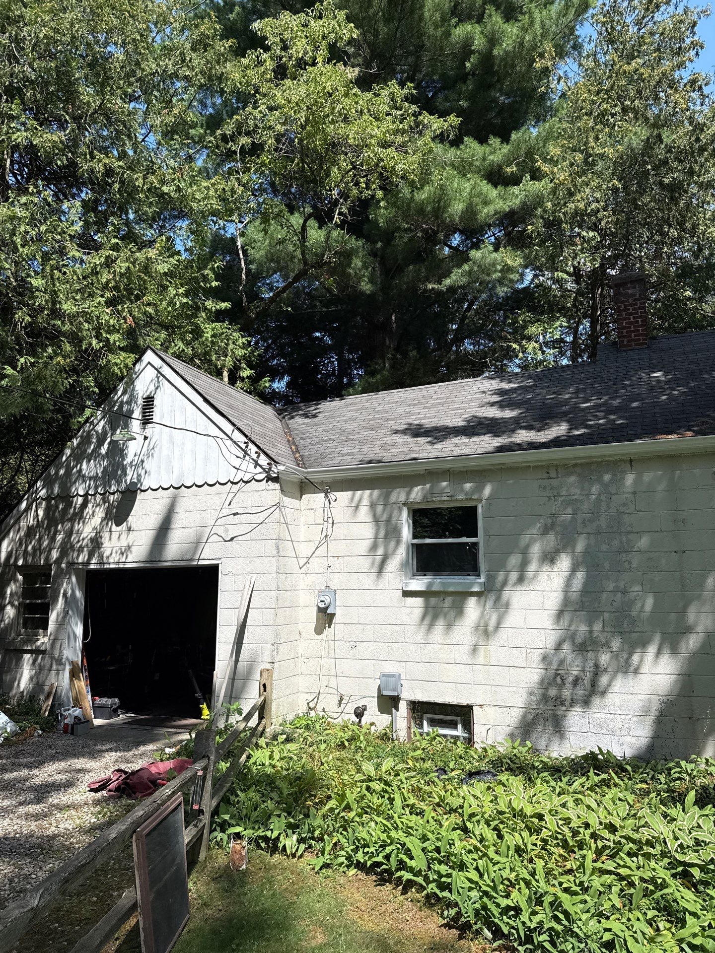 White Metal Gutter and Downspout Installation in Bellaire by Rainbow Seamless Systems