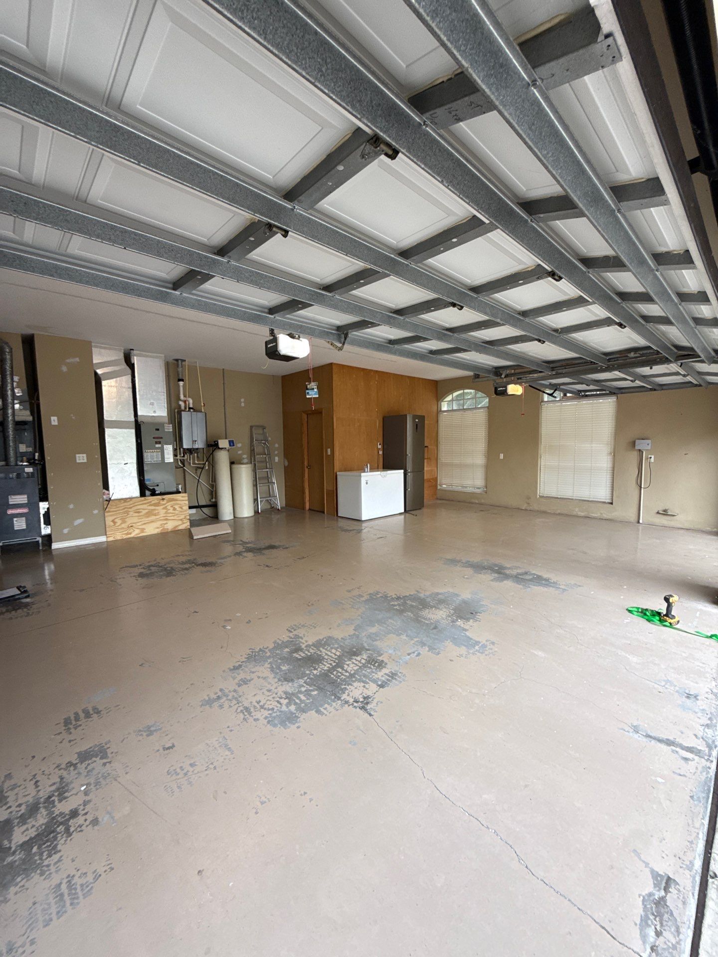 Tampa Garage Floor Coating and Overhead Storage Rack Installation by Square 1 Garage and Closet Solutions