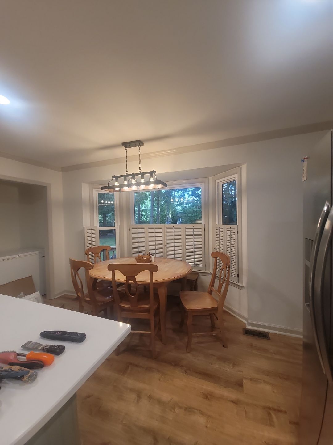 A Pathway to Personality – A Two-Tone Kitchen Transformation in Apex by Elite Remodeling and Design LLC